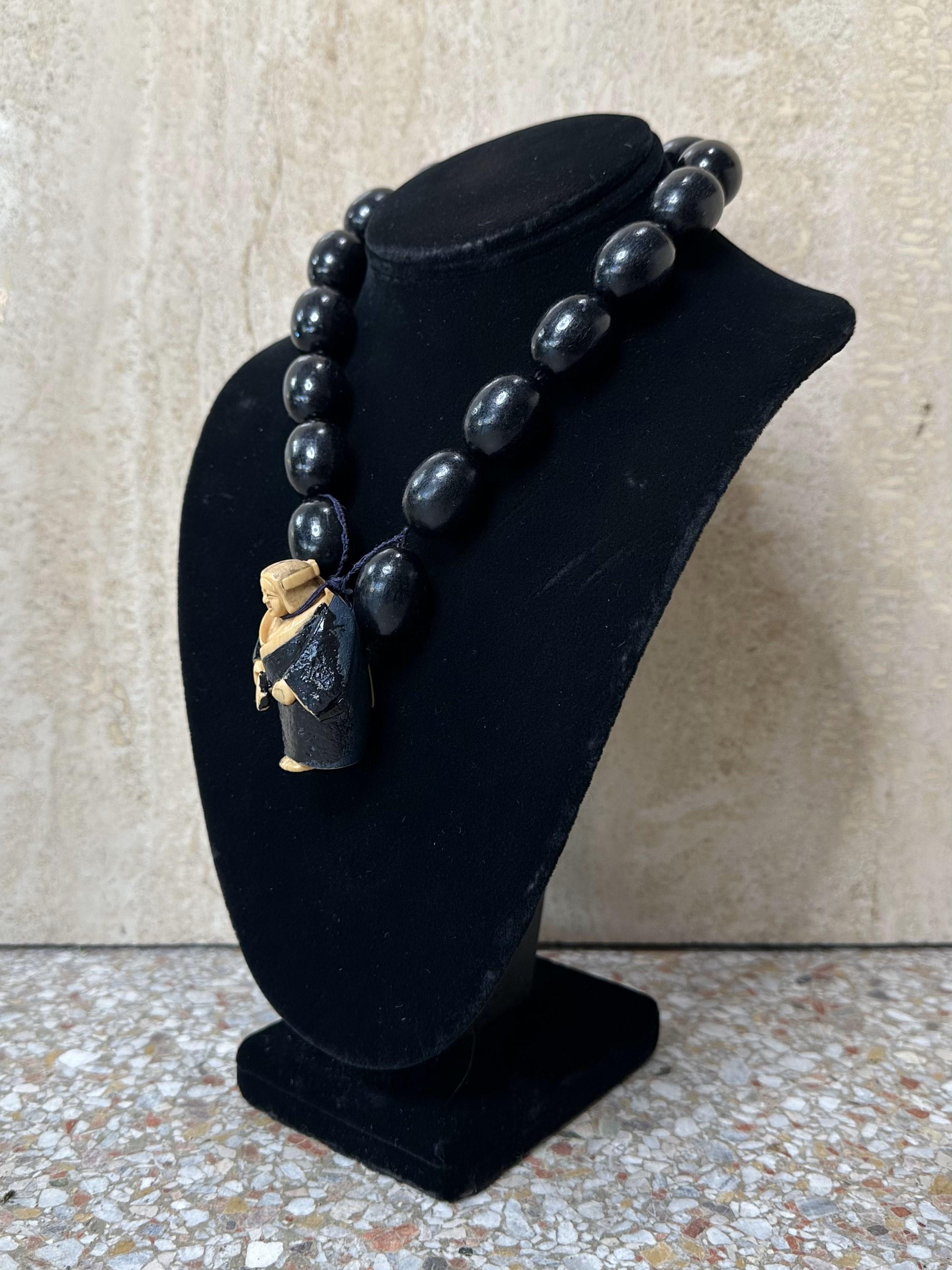 A Vintage Carved Asian Female Buddha Necklace is a beautifully unique piece of jewelry that likely combines spiritual symbolism with intricate craftsmanship. This necklace would typically feature a female Buddha carving, which is a rare and