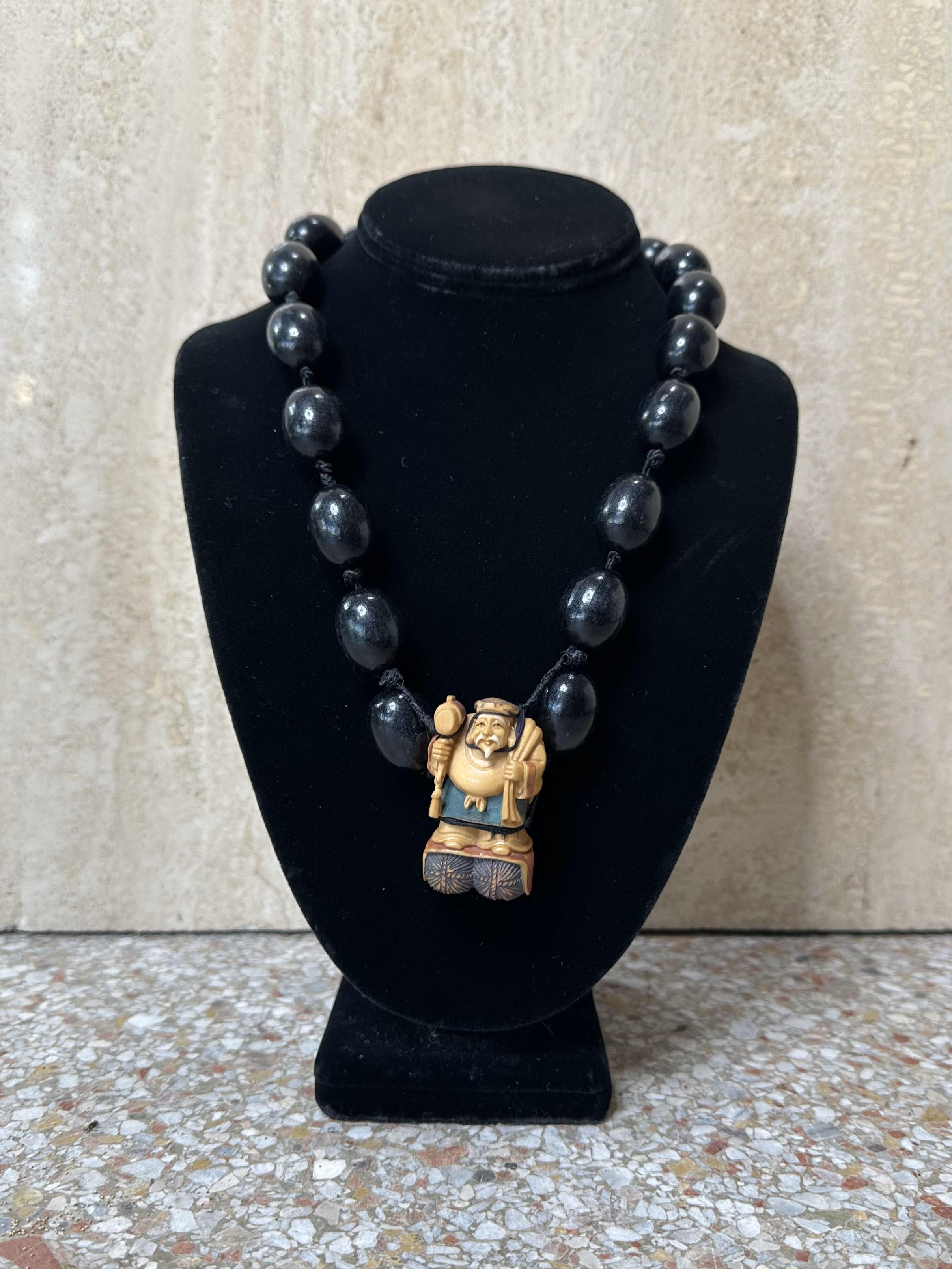 A Vintage Asian Male Buddha Rope Necklace is a unique and intriguing piece of jewelry that likely combines spiritual symbolism with a bold design. The Buddha motif, often associated with peace, wisdom, and enlightenment, paired with the rope style,