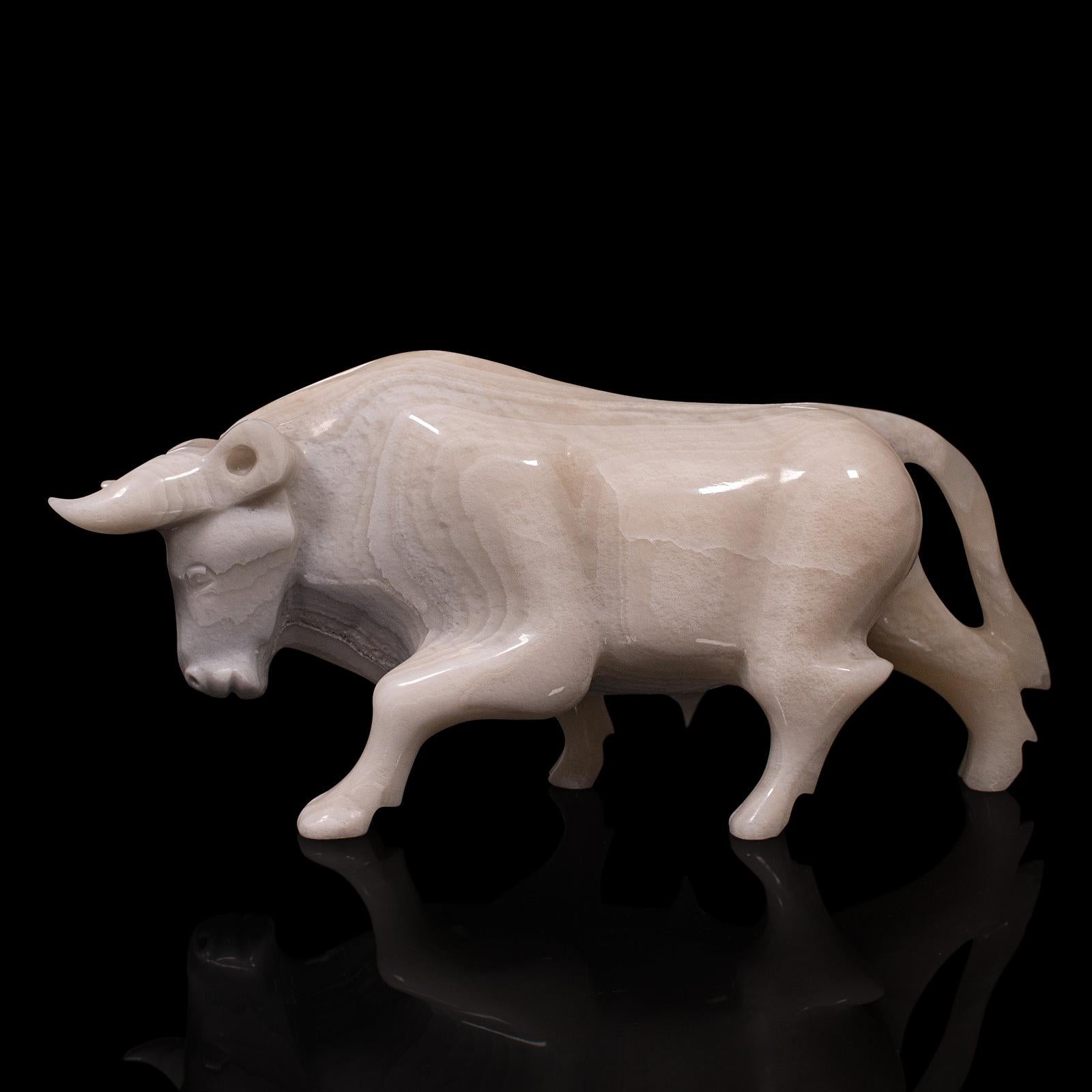 This is a vintage carved bull. An English, white onyx ornamental animal display figure, dating to the mid 20th century, circa 1950.

Striking mid-century craftsmanship and material quality
Displays a desirable aged patina in good order