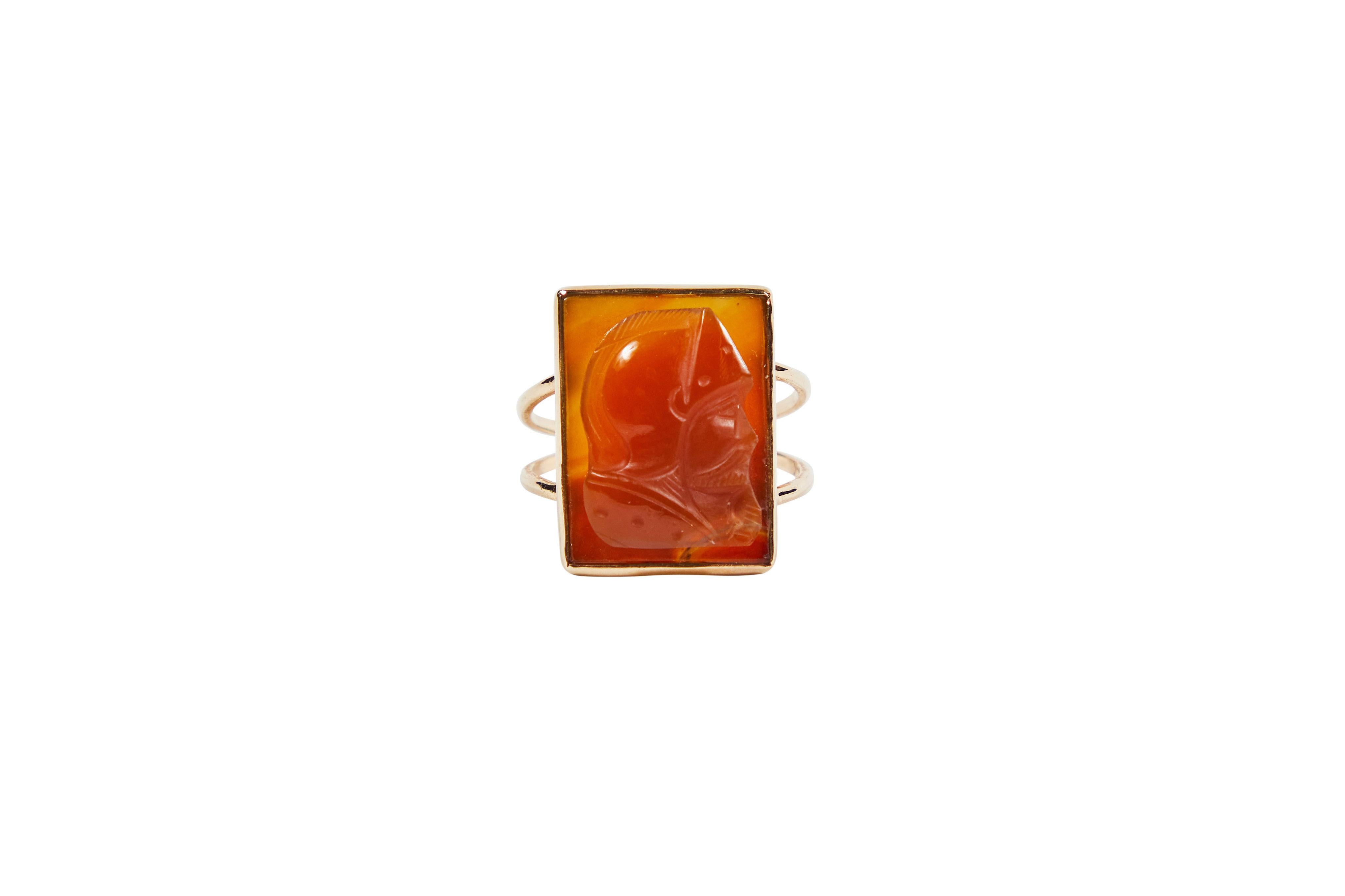 Handsome rectangular carved carnelian cameo ring made from a vintage cuff links now set in a new 14KT gold setting. Carving is of a bearded knight in helmet.

Size 7