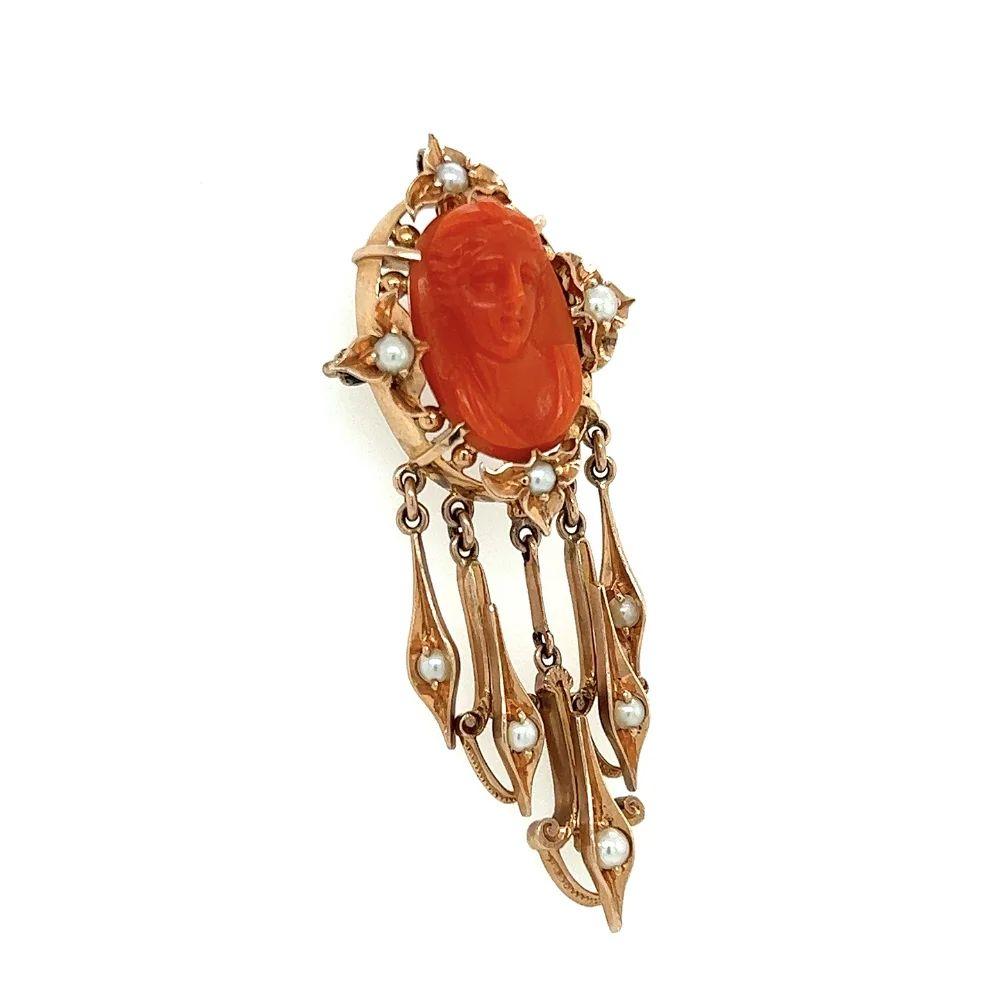 Simply Beautiful! Hand carved Coral Cameo and Seed Pearl Brooch Pendant. Featuring of a Female Portrait, accented by Seed Pearls and Pearl set dangling drops. 14K Rose Gold mounting. Rendered with remarkable detail and warmth, so unusual to find!