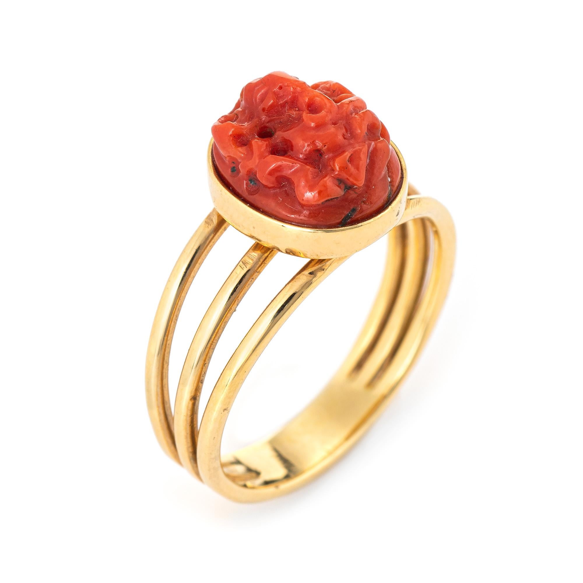 Finely detailed carved coral cocktail ring crafted in 14 karat yellow gold.  

Carved coral measures 9.3mm x 7.75mm. The coral is in excellent condition and free of cracks or chips. 

The ring offers a lot of symbolism. The coral is carved with the