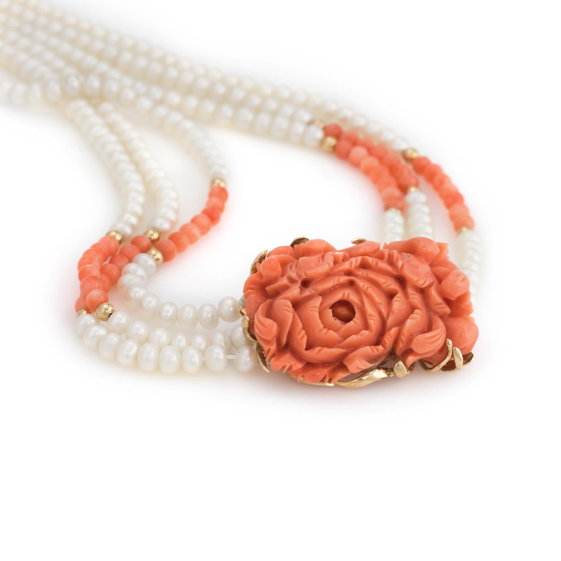 Elegant vintage coral & freshwater pearl necklace with 14 karat yellow gold details.

One piece of coral is carved in the form of a flower and measures 1 1/4 x 1 inch. Coral beads are strung onto the necklace and each measure 3.5mm. The freshwater