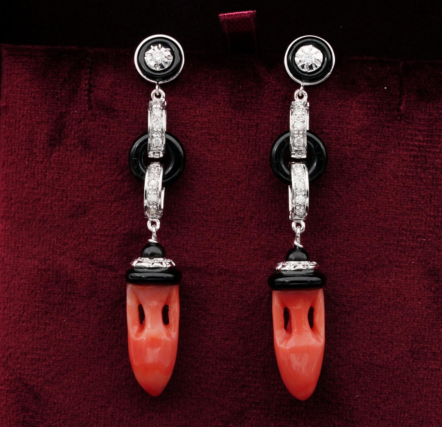 Sign of Distinction

Charming pair of Carved Coral Onyx and Diamond long drop earrings
Hand crafted of solid 18 Kt white gold – 1980 ca
Charming design made up by a classic combination of Salmon colour Coral and Black Onyx skilfully mounted of solid