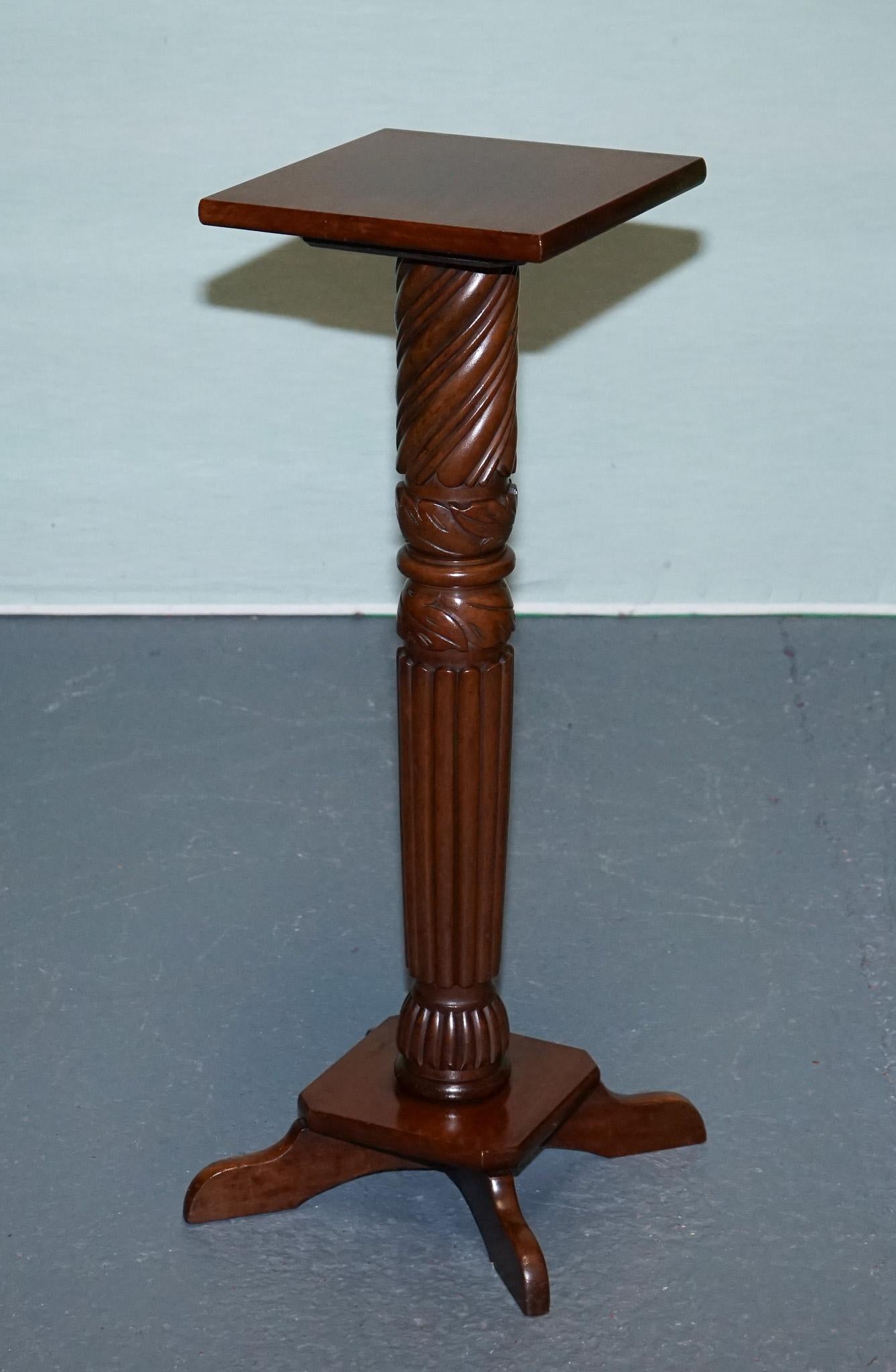 
Antiques of London



A finely made vintage hardwood pedestal stand featuring a decorative barley-twist style column with carved detailing. The square top is ideal for displaying a potted plant, sculpture, or decorative item, while the fluted and
