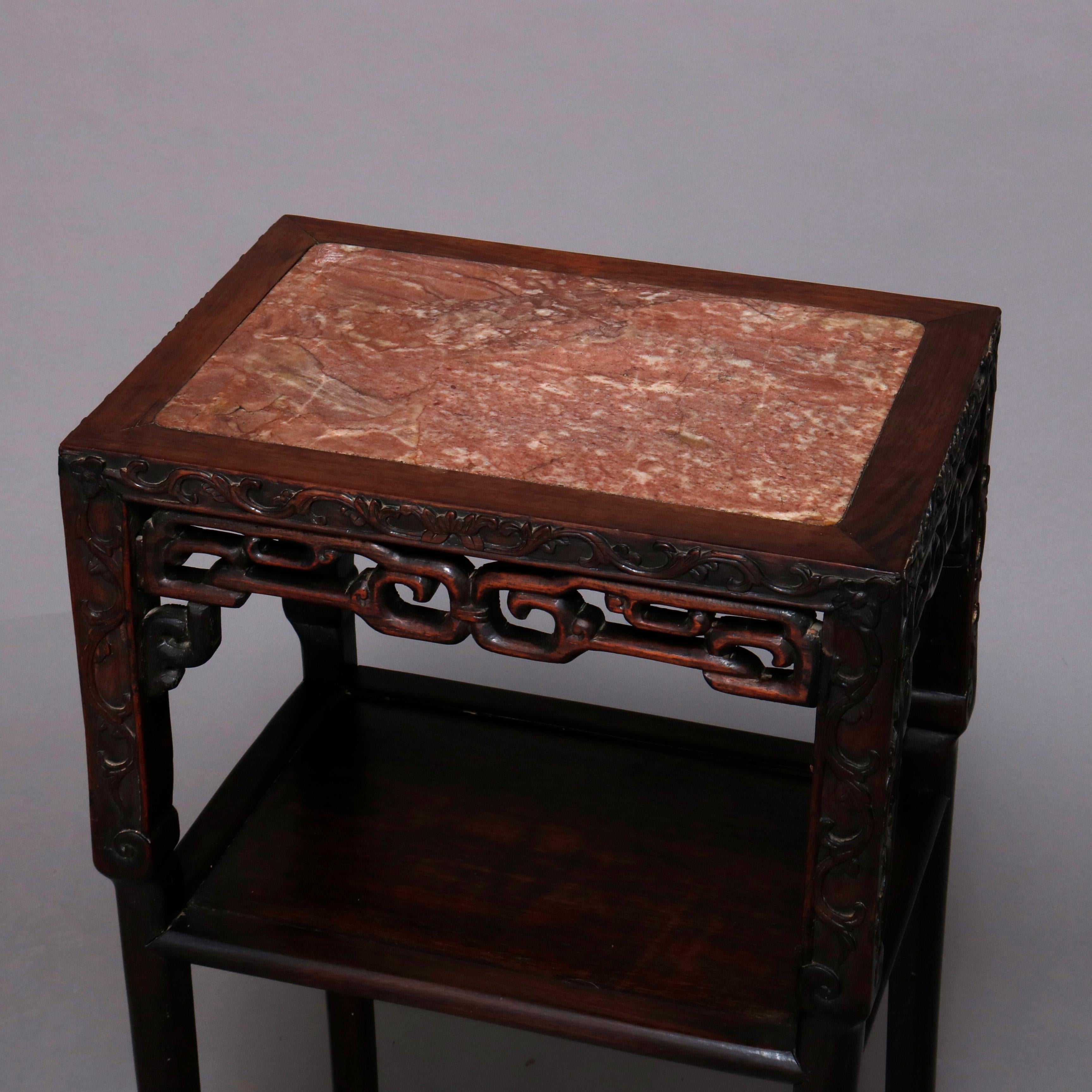 A vintage Chinese plant or side stand offers inset marble top seated in carved hardwood frame having pierced skirt and lower display shelf, 20th century.

***DELIVERY NOTICE – Due to COVID-19 we have employed LIMITED-TO-NO-CONTACT PRACTICES in the