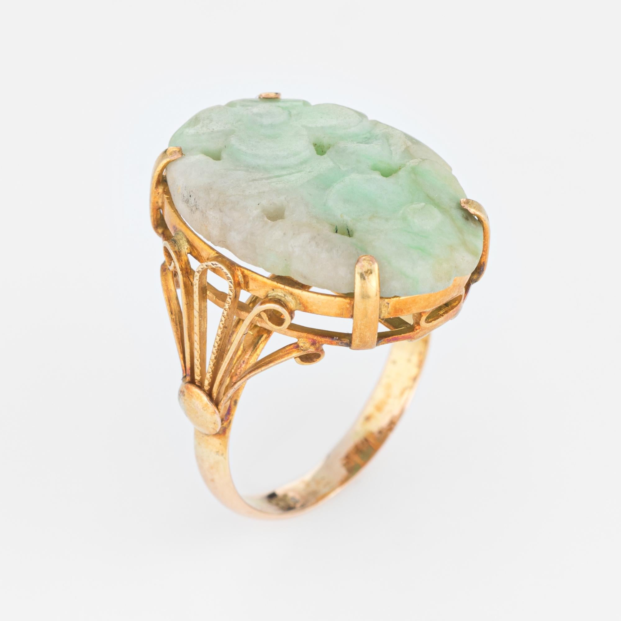 Finely detailed vintage carved jade cocktail ring (circa 1940s to 1950s), crafted in 14 karat yellow gold. 

Jade is carved in the form of a flower measuring 22mm x 15mm. The jade is in excellent condition and free of cracks or chips. 

The stylish