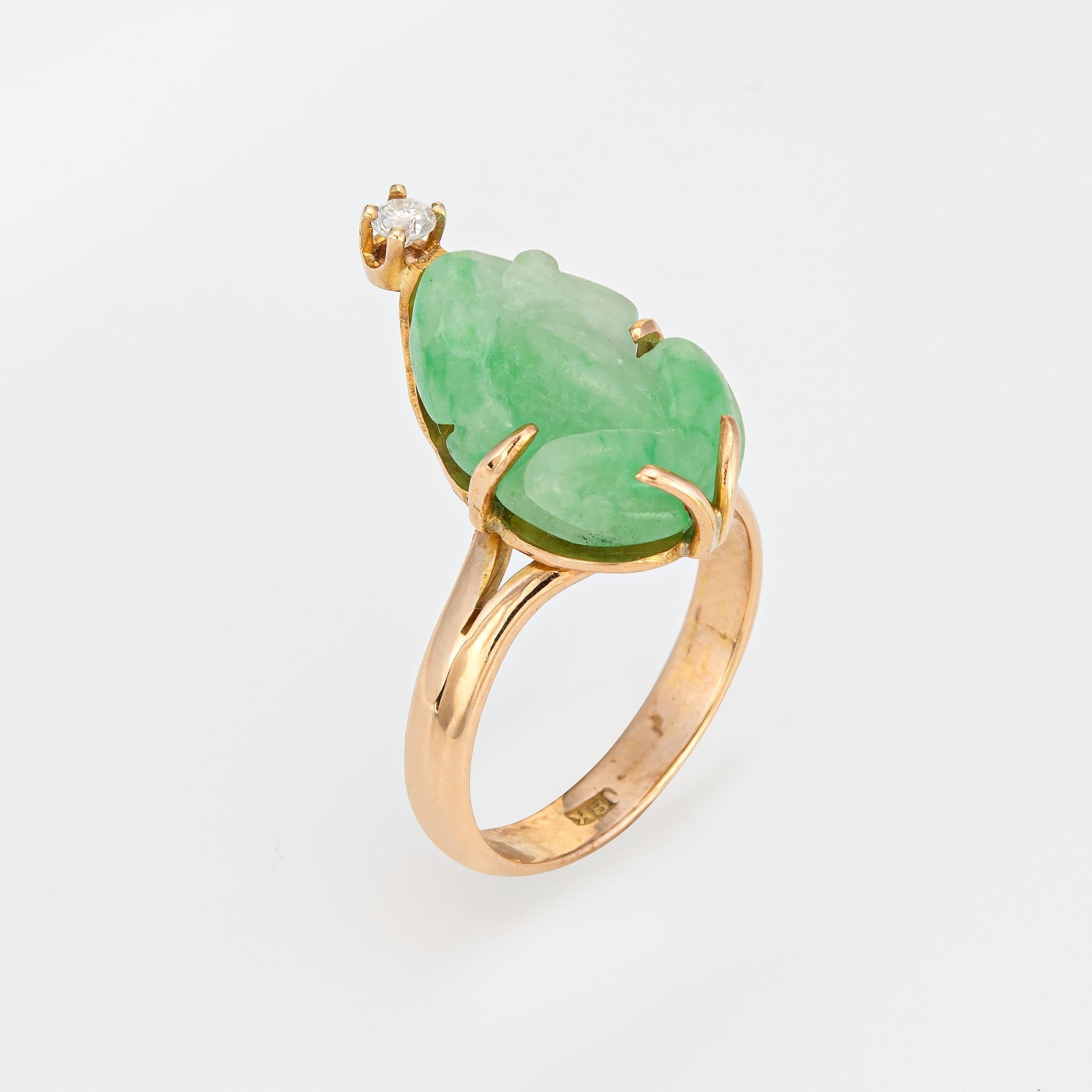 Stylish vintage carved jade frog & diamond ring (circa 1960s to 1970s) crafted in 14 karat yellow gold. 

Carved jade measures 13mm x 9mm. One diamond is estimated at 0.03 carats (estimated at I-J color and I1 clarity). The jade is in good condition