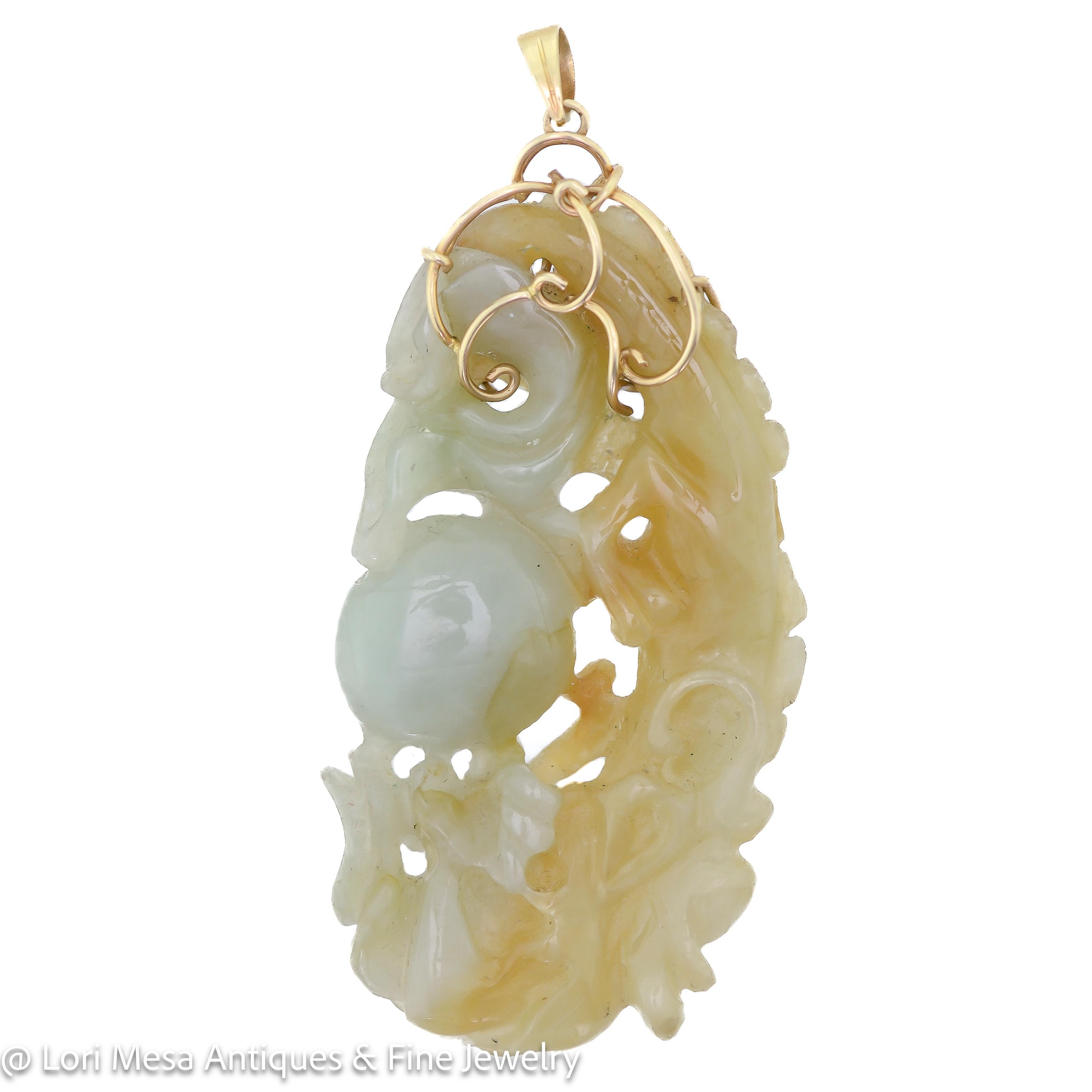 This is a vintage pendant that has been beautifully carved from jade. The pendant comes in a combination of light brown and pale green colors, which gives it a unique and elegant look. The pendant also features a 