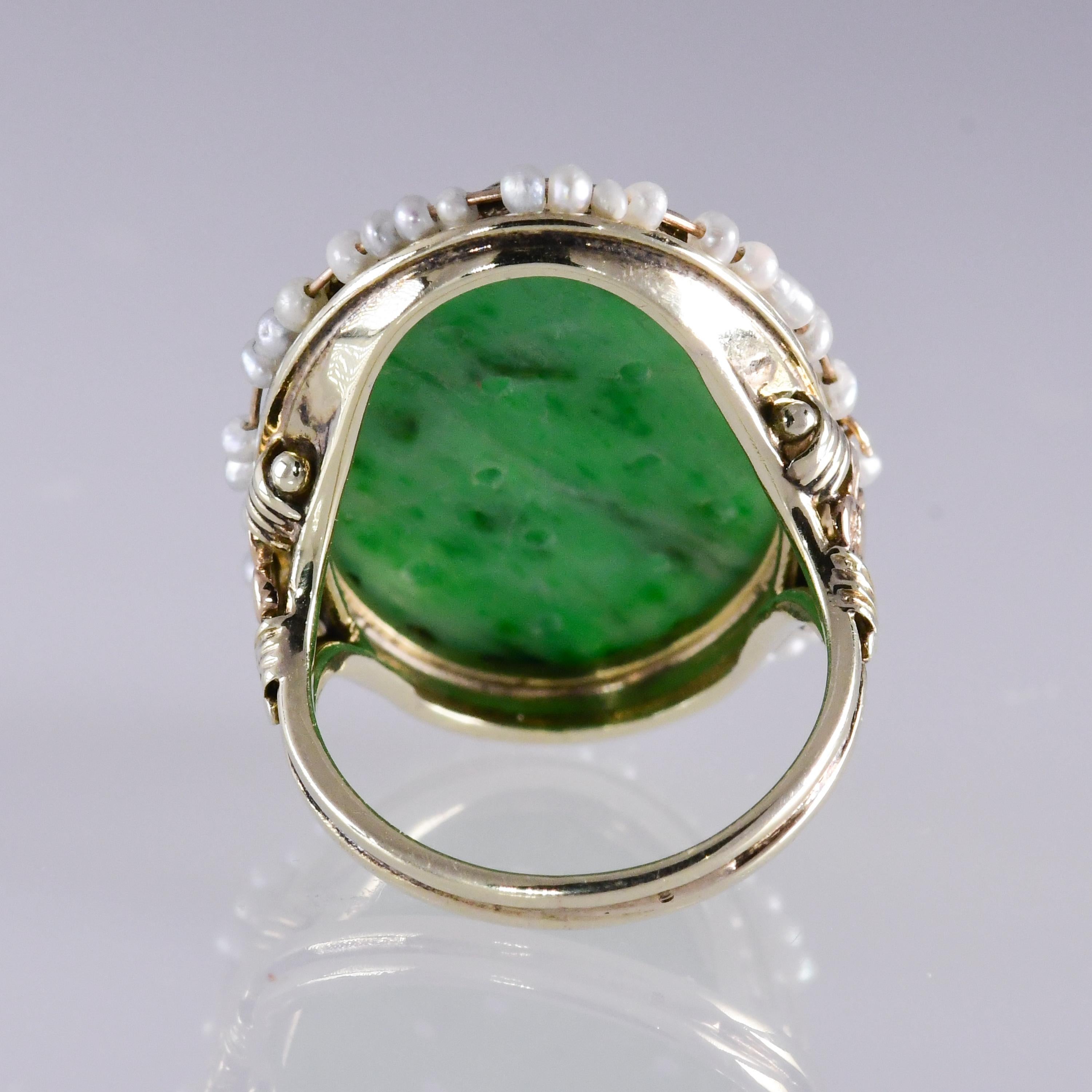 Oval Cut Vintage Carved Jadeite Ring Encircled with Seed Pearls 14 Karat Yellow Gold For Sale