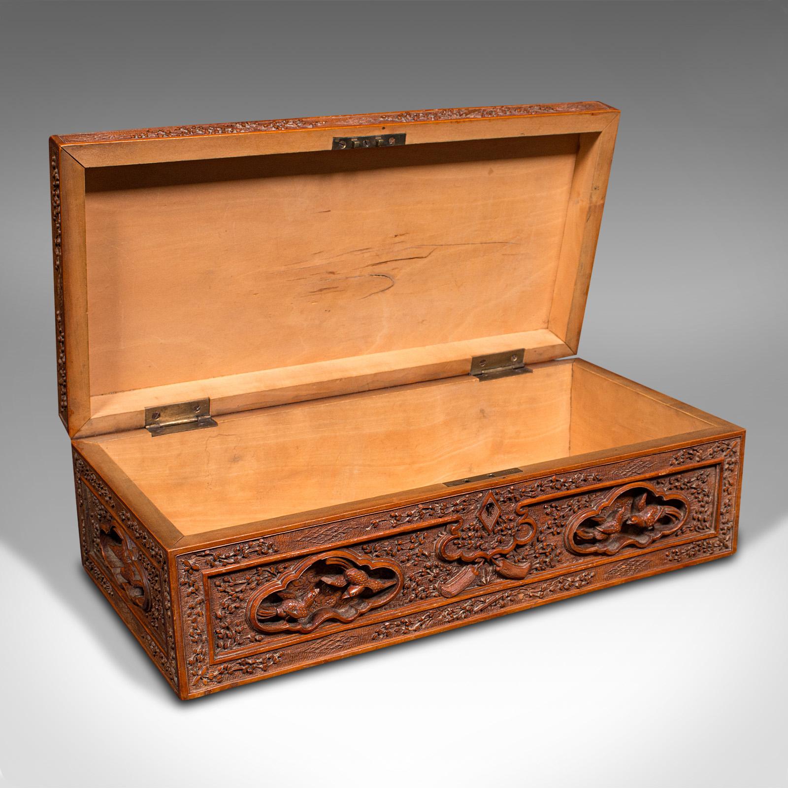 This is a vintage carved keepsake case. A Chinese, satinwood decorative box, dating to the mid 20th century, circa 1950.

Profusely carved throughout with an abundance of Oriental craftsmanship
Displaying a desirable aged patina - some small loss to