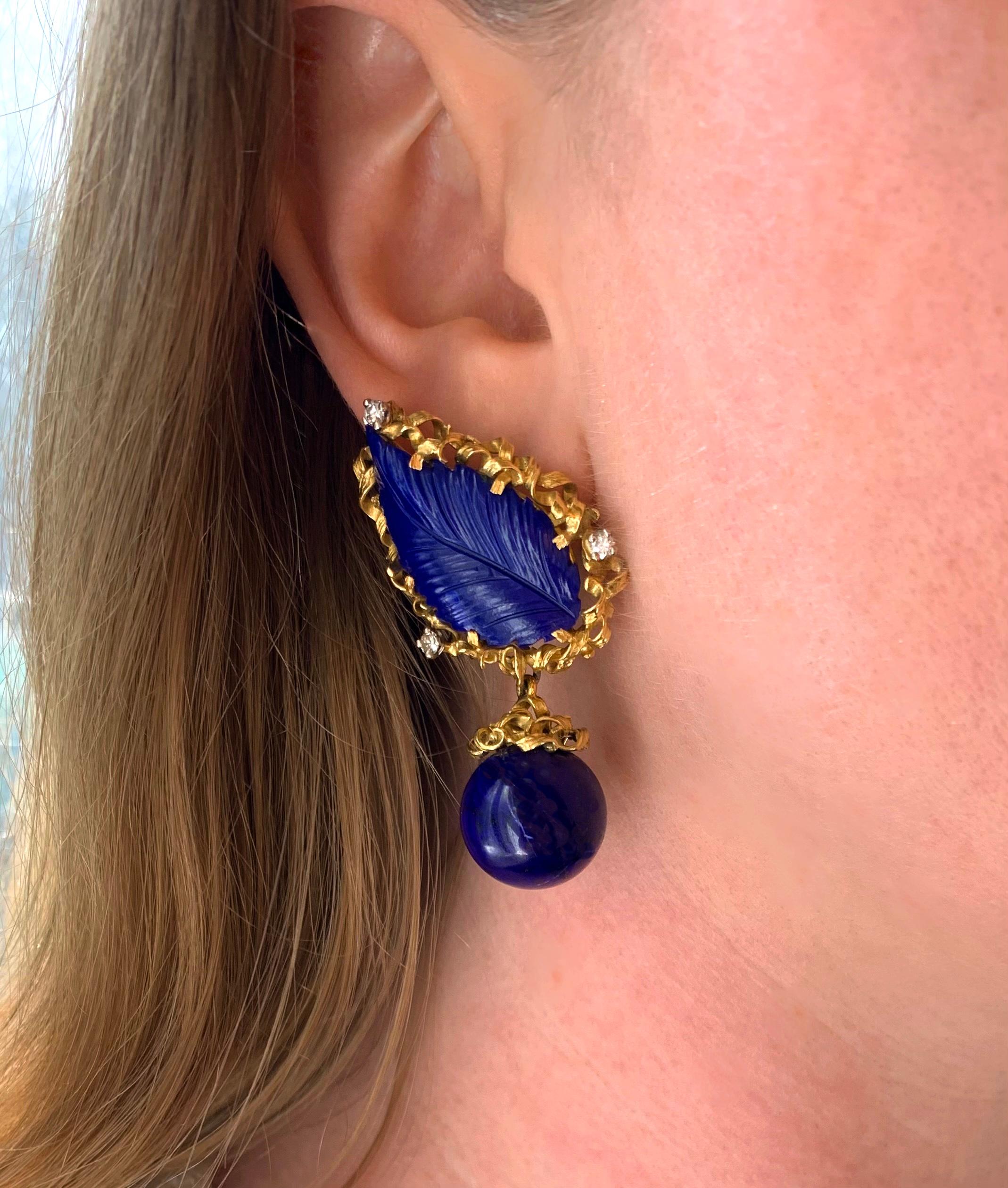 A very fine pair of day to night lapis lazuli, diamond and 18 karat yellow gold earrings, circa 1975 which can be worn during the day or transformed for a night out.

This pair of stunning dangle earrings have a beautifully carved deep-hued lapis