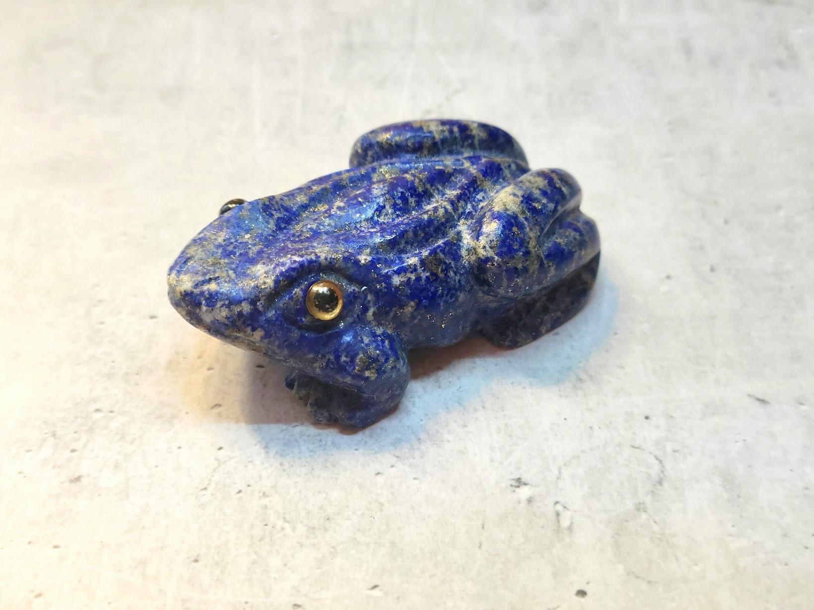 A stunning piece of accent decor handcrafted from the most beautiful natural lapis lazuli stone.

A wonderful frog carved from a single high-quality piece of lapis lazuli, with natural inclusions of golden pyrite. Amazing figurine! 
The frog