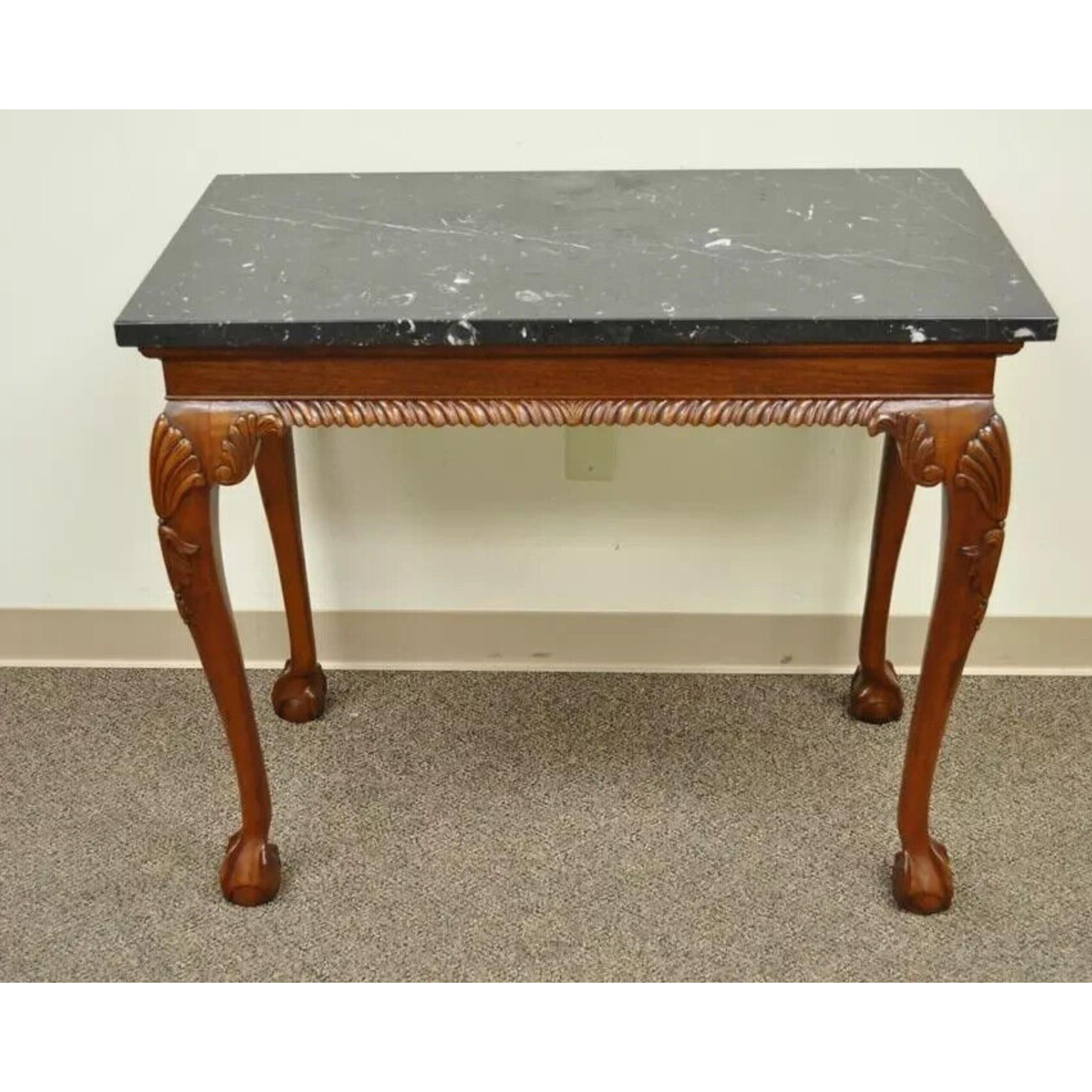 Vintage Carved Mahogany Chippendale Style Ball and Claw Marble Top Console Table (B). Item features a marble top, shapely legs with shell carved knees, ball and claw feet, rope carved front skirt, very nice vintage item. 
Circa  Late 20th Century.