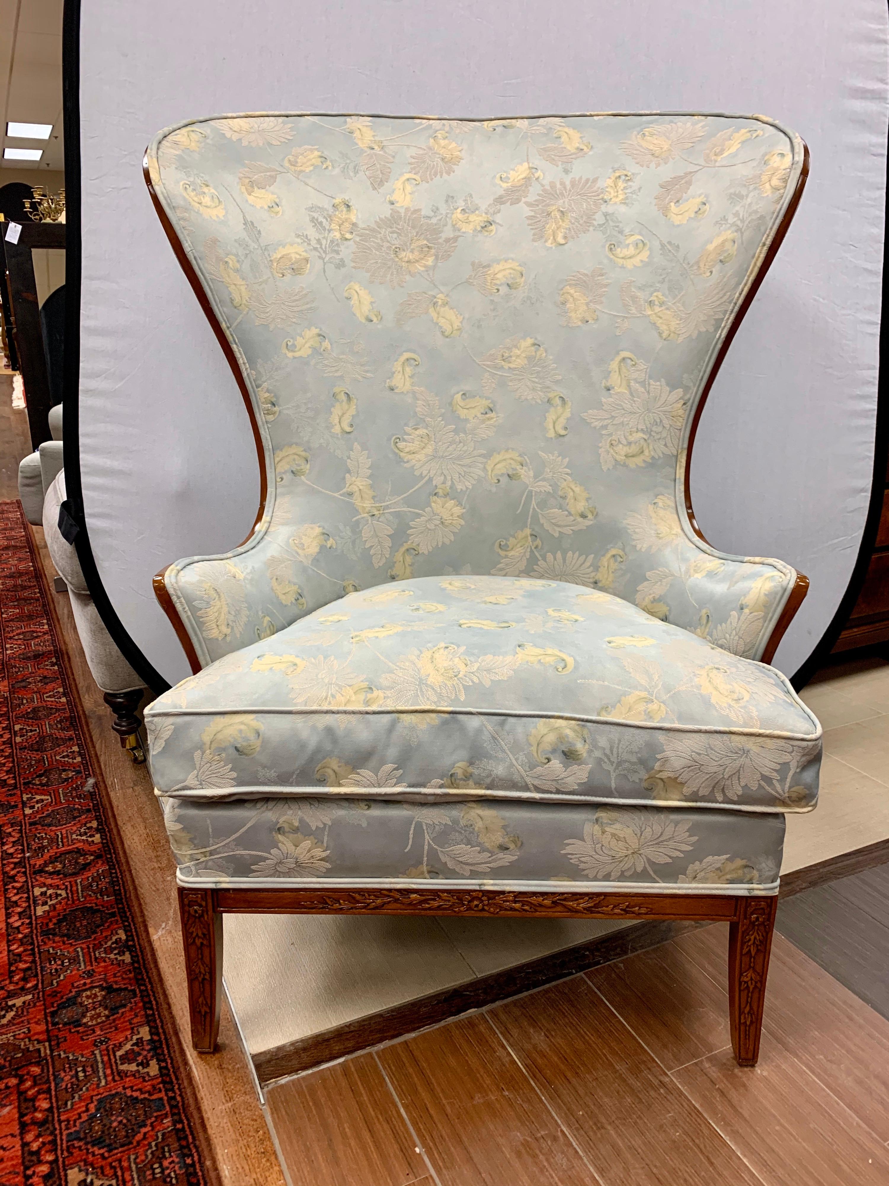 Sculptural large vintage papa bear wingback reading chair which features new floral fabric, see pictures.
The color of the fabric is a seafoam blue with cream and green floral throughout, circa 1950s and features gorgeous carvings at the legs.