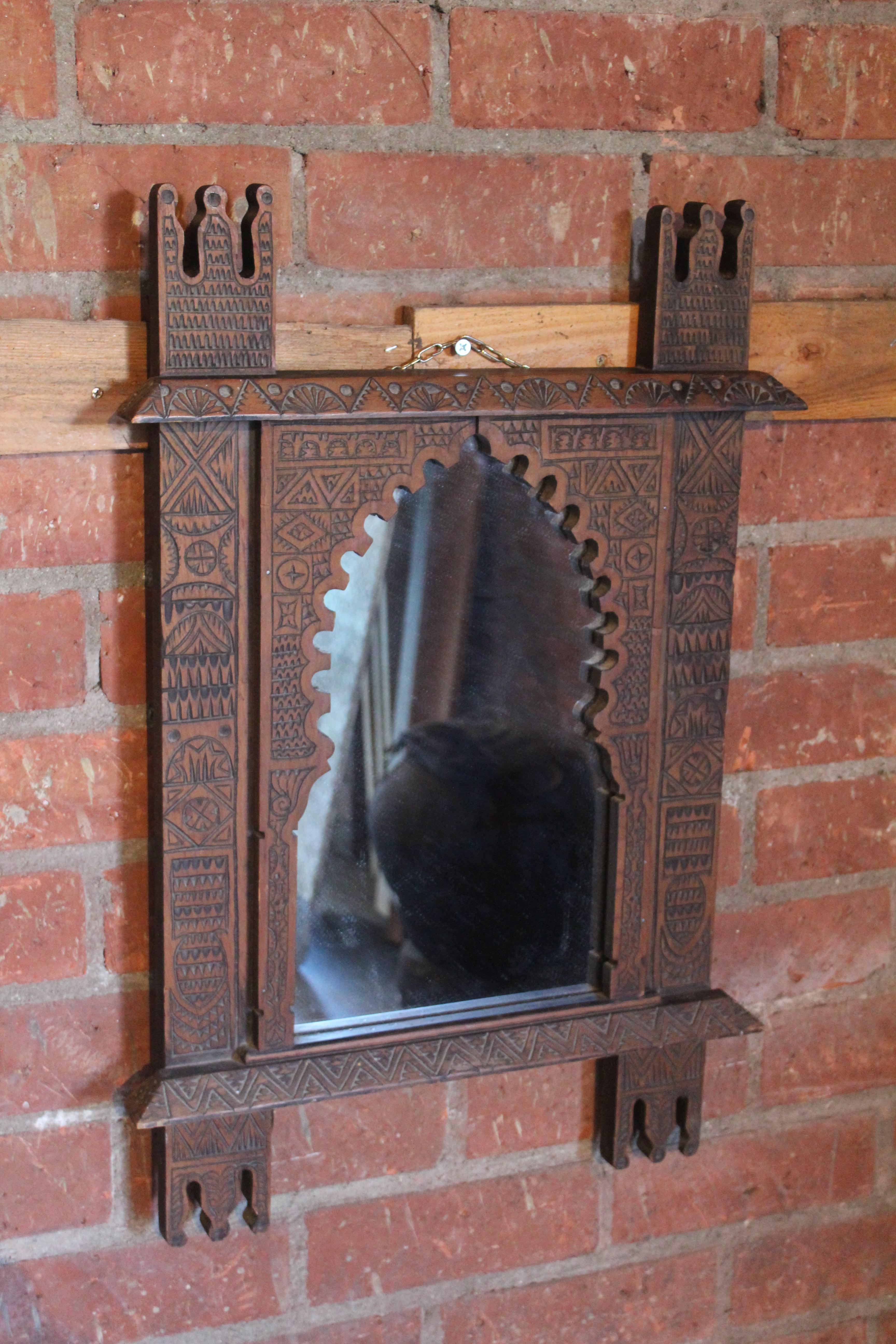 A vintage Moorish style carved wood mirror. New mirror