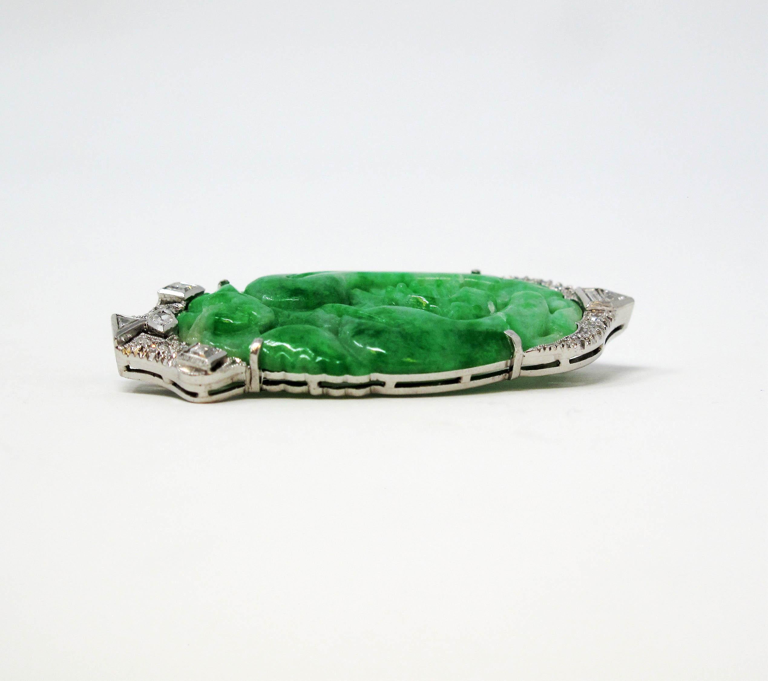 Absolutely gorgeous vintage jadeite and diamond brooch. This wearable piece of art is filled with vivid color, intricate design and incredible attention to detail. Add it anywhere you need a touch of vintage glamour. 

This lovely brooch features a