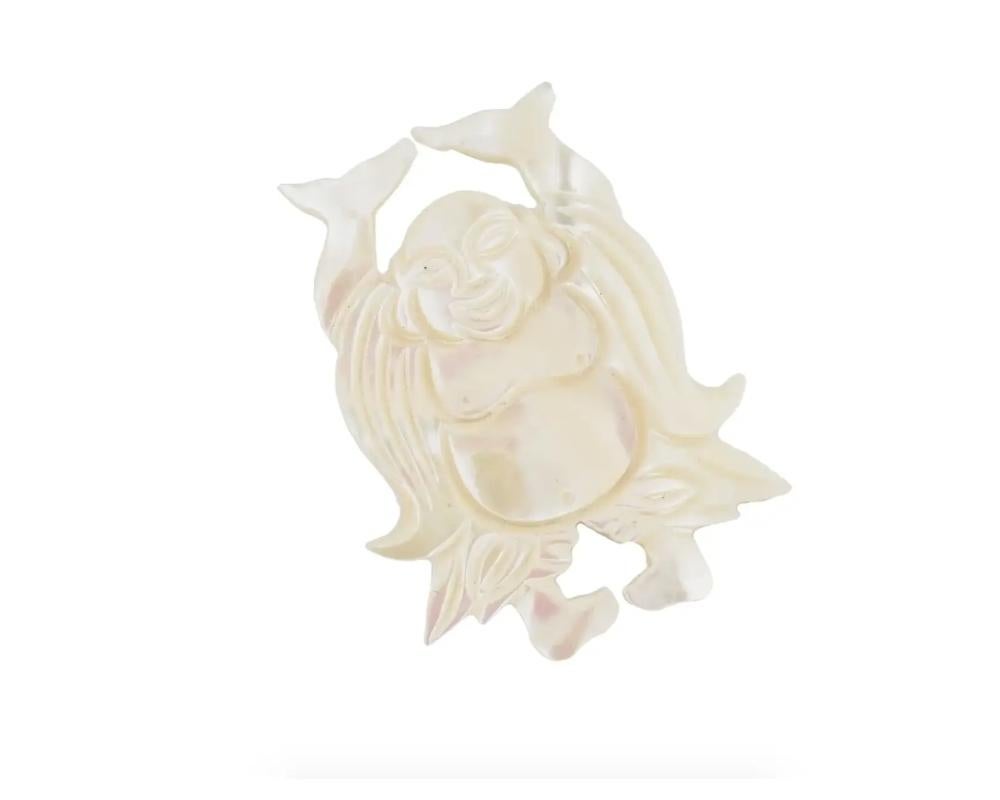 A vintage carved mother-of-pearl figural brooch representing Laughing Buddha, also known as Fat Buddha or Budai. Pin backing. Oriental Buddhist Lapel Jewelry And Accessories For Women.

Dimensions: 1 1/2 x 1 1/4 in. All measurements are