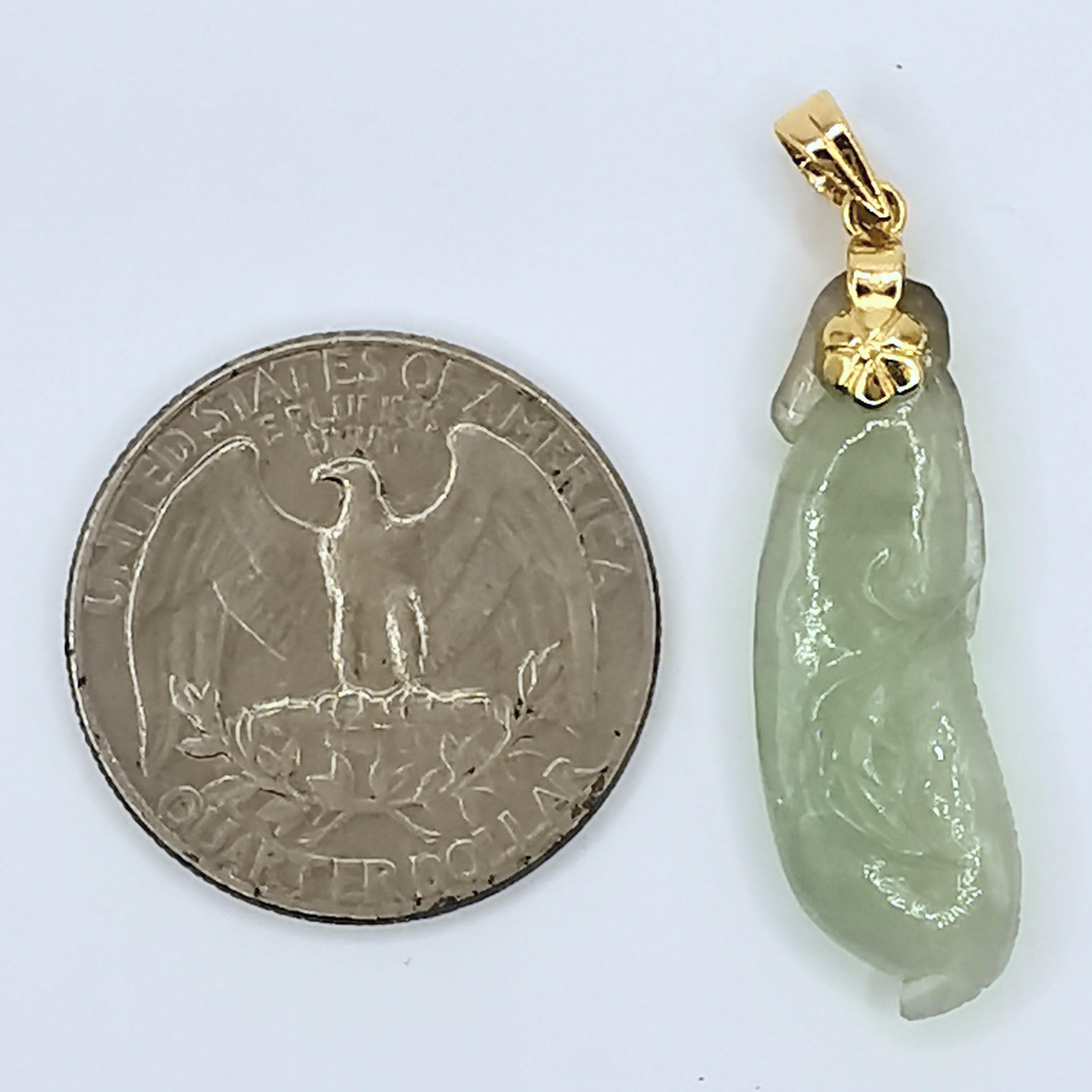 Introducing our stunning Vintage Carved Natural Jadeite Jade and Diamond Pendant Necklace, crafted in yellow gold. The pendant features a natural light green icy jadeite jade, intricately carved with a unique vintage design. The jadeite jade is a