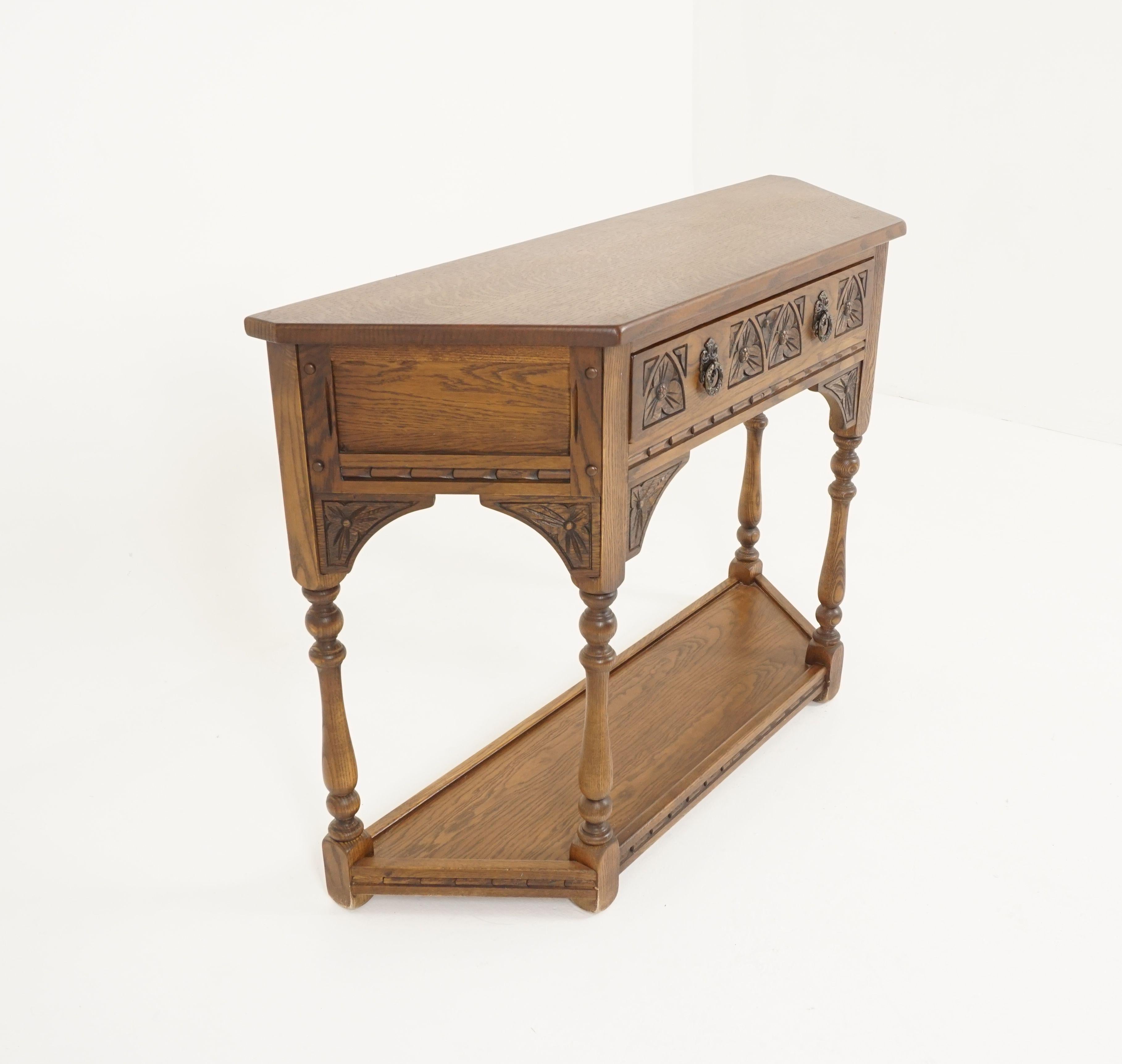 Vintage carved oak hall table, sofa table, England, 1940

Scotland, 1940
Solid oak
Original finish
Oak top
Single carved drawer underneath
Standing on turned legs
With undershelf and moulding on the base 

B2309

Measures: 41