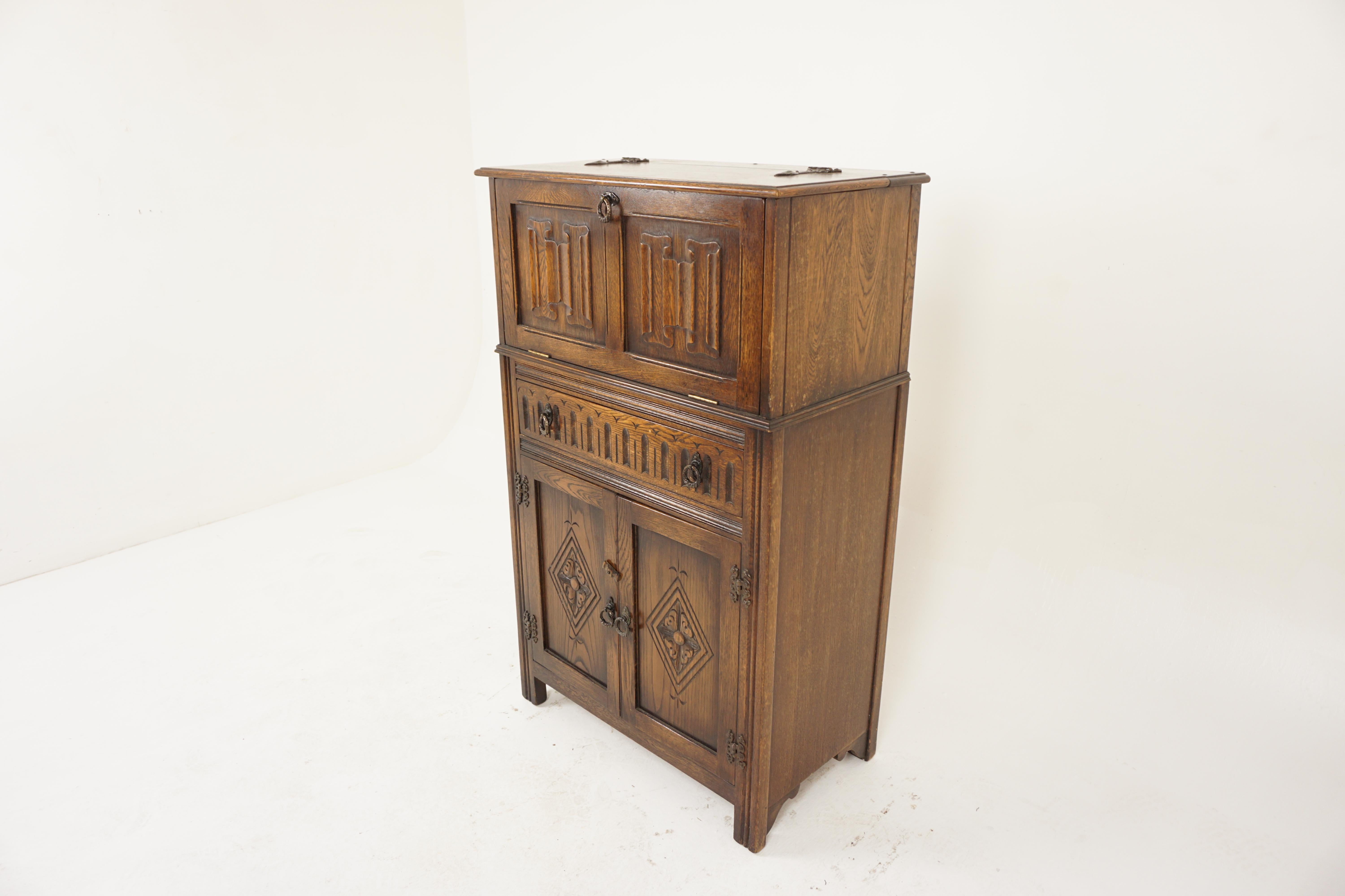Vintage Carved Oak Linen Fold Cocktail Cabinet, Bar Cabinet, Scotland 1940, H1153

Solid Oak
Original finish
Upright carved oak cabinet
With hinged top that opens to reveal a mirrored back with a glass shelf
A generously sized cupboard