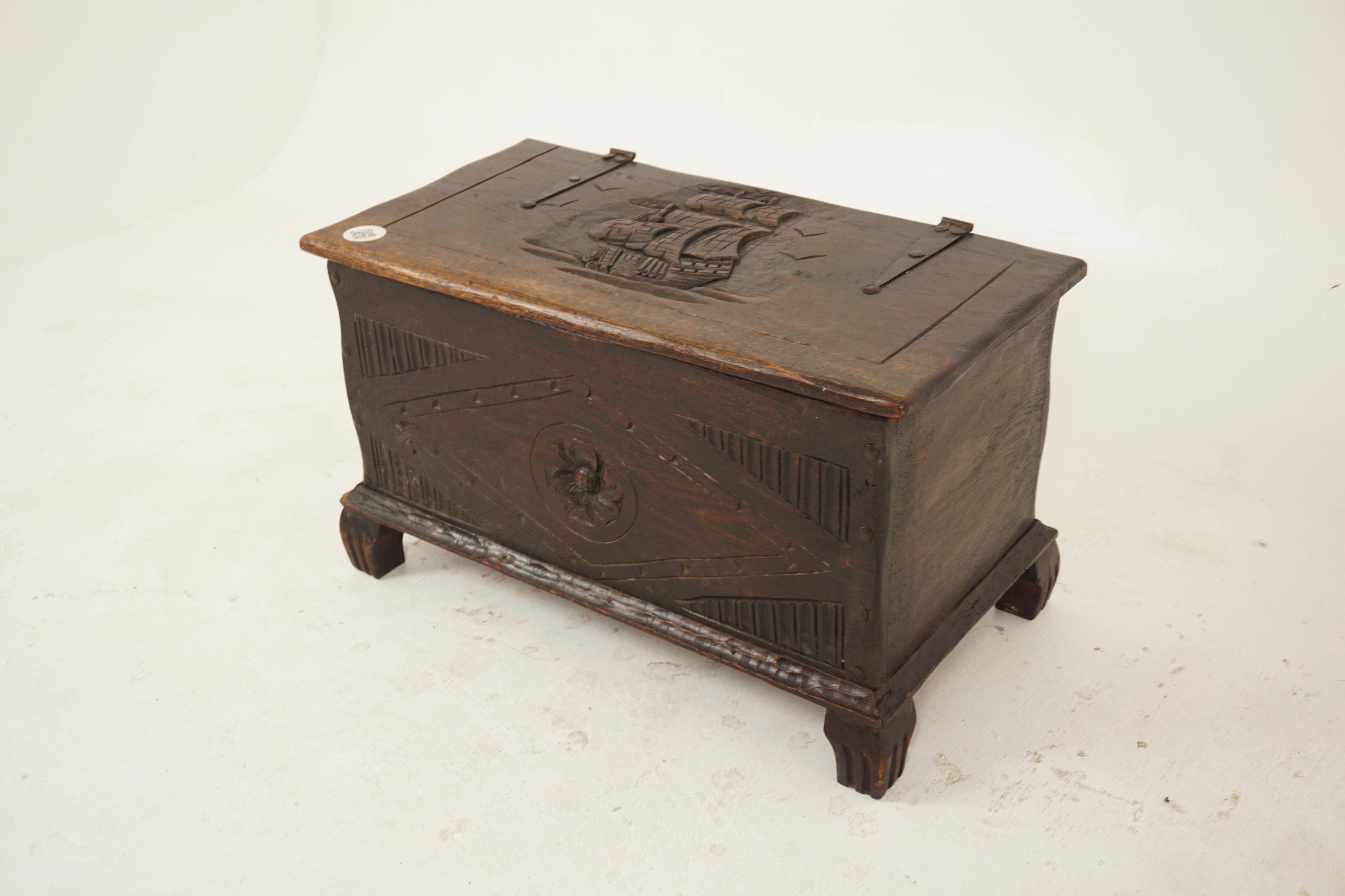 Vintage carved oak trunk, coffer, coffee table nautical, Scotland 1920, H713.

Solid Oak.
Original Finish.
Carved sail ship on top.
Thick metal hinges.
Lift up top with storage inside.
Carved front with moulded carved edge around the