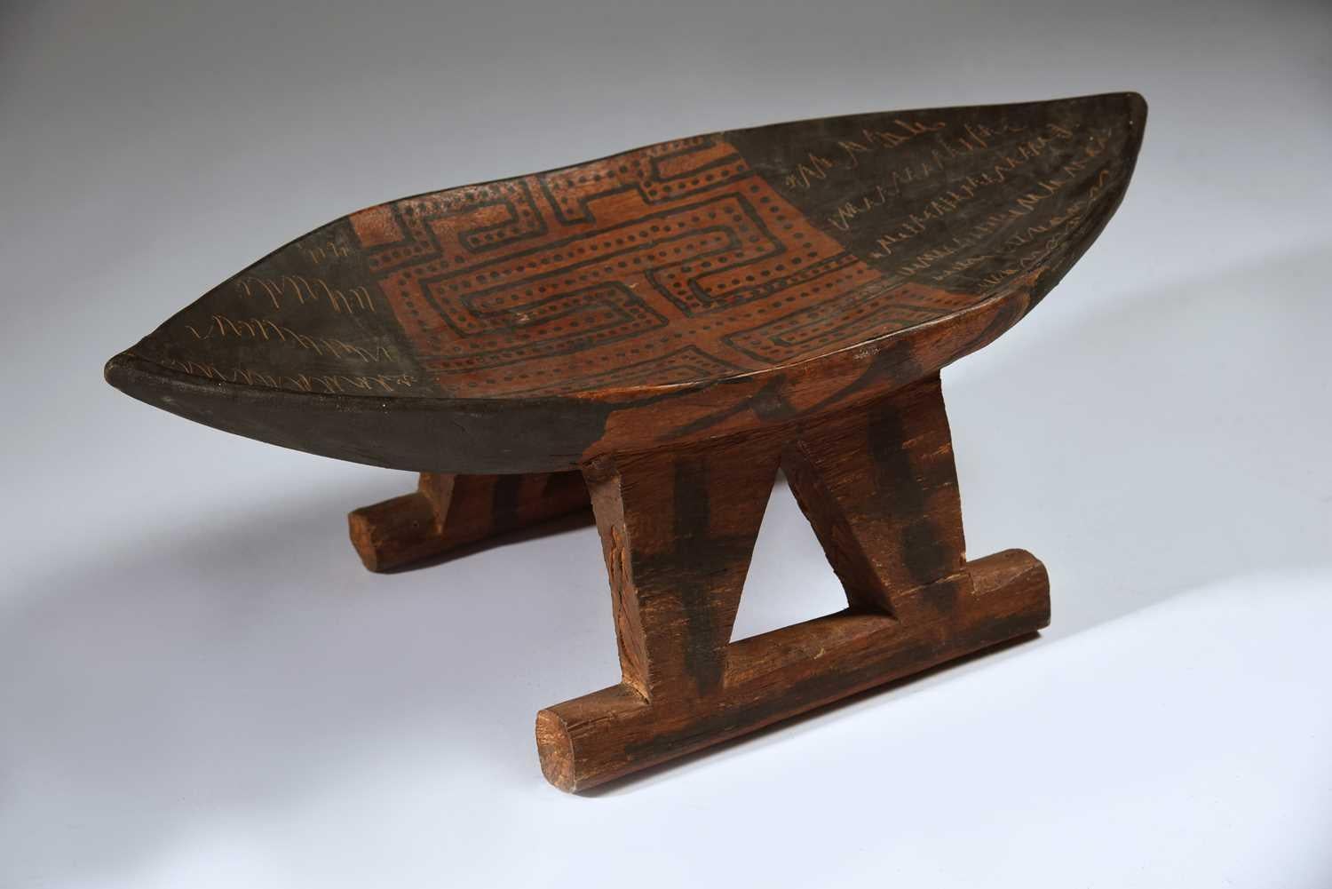 A fine Vintage carved pained Suriname stool with painted and scratched decoration, Tribal South Latin American Antiques
 
Suriname South America
 Measures: 21 cm height, 57 cm length
Condition: Fine
Ex missionary collection
Period early to