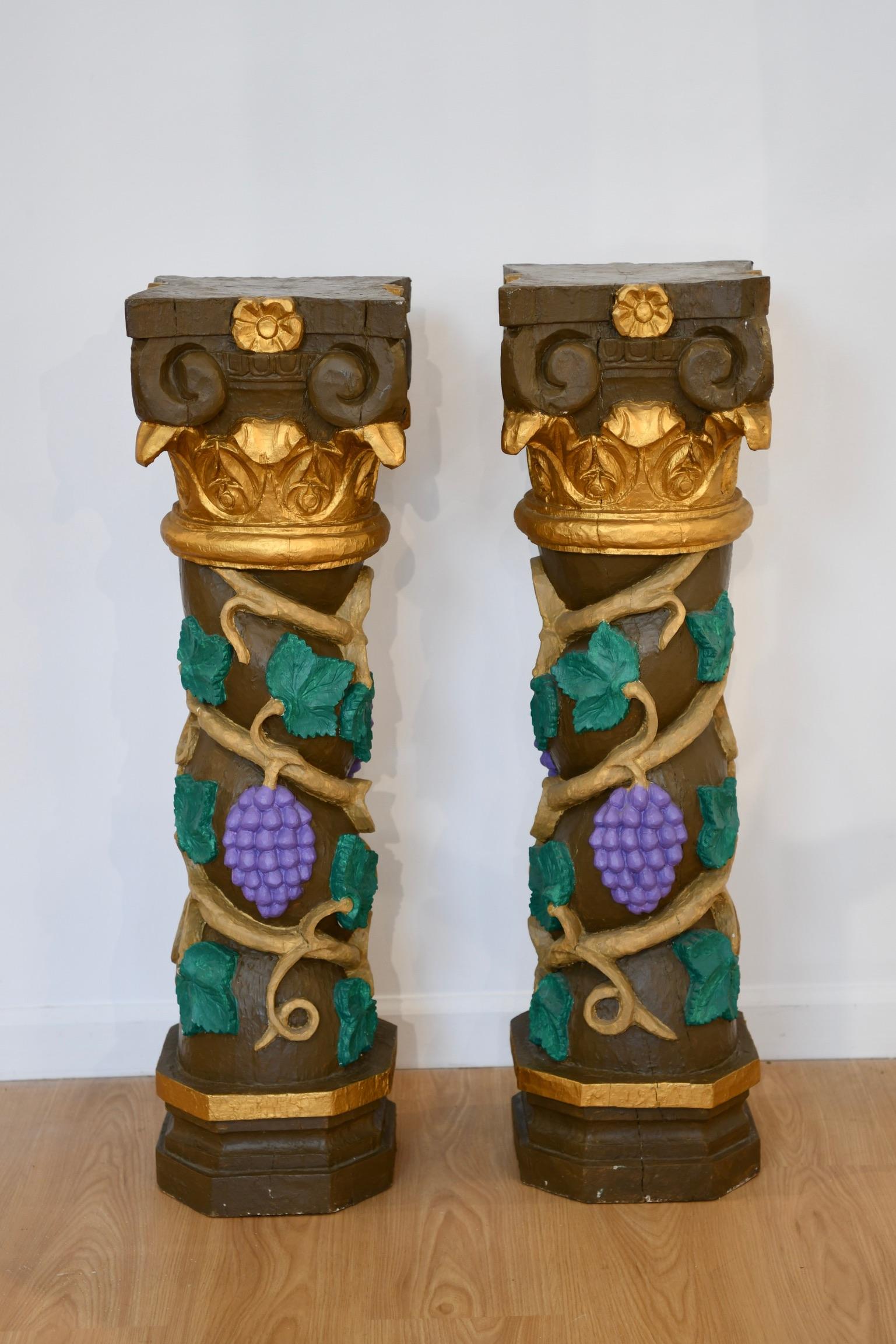 Vintage carved and painted pedestals with grape and vine motif. Sold as pair. Dimensions: 36