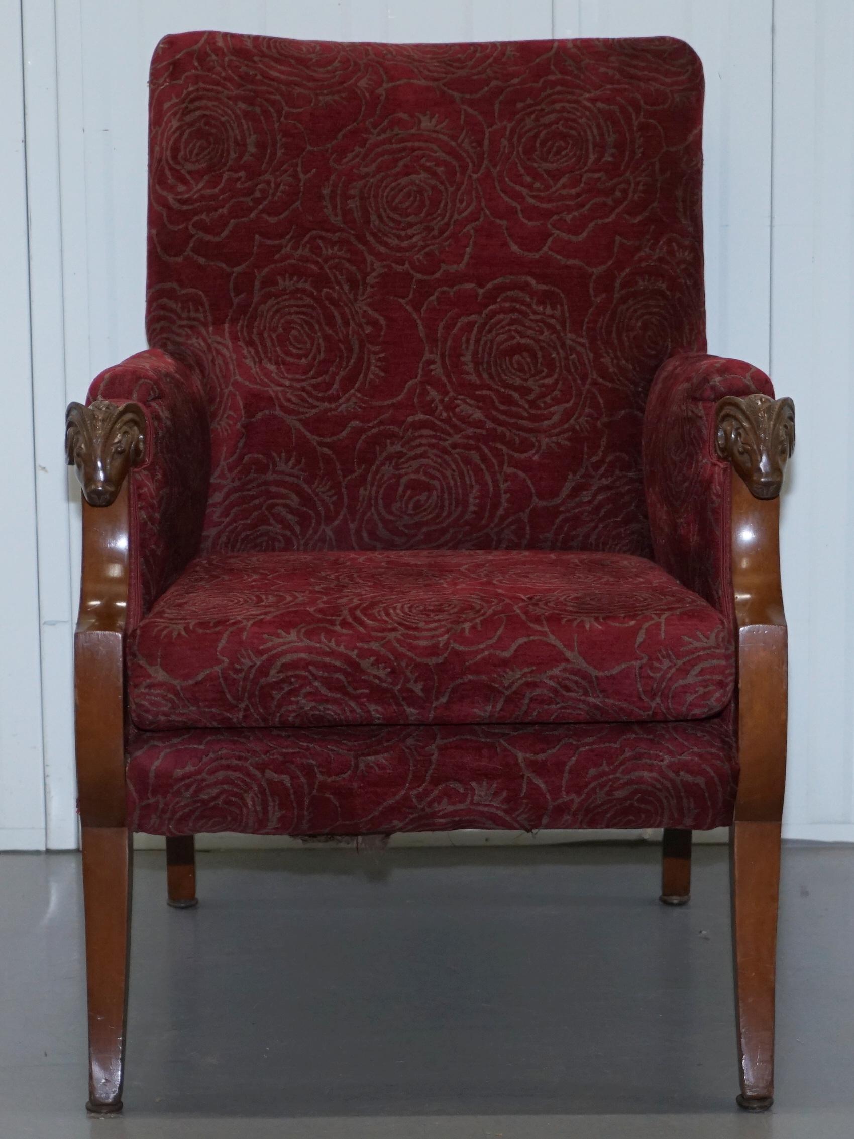 We are delighted to this lovely vintage rams head armchair with red floral upholstery

This chair is in fine order, the upholstery has been professionally cleaned, the timber cleaned waxed and polished

It’s a very comfortable and fantastic