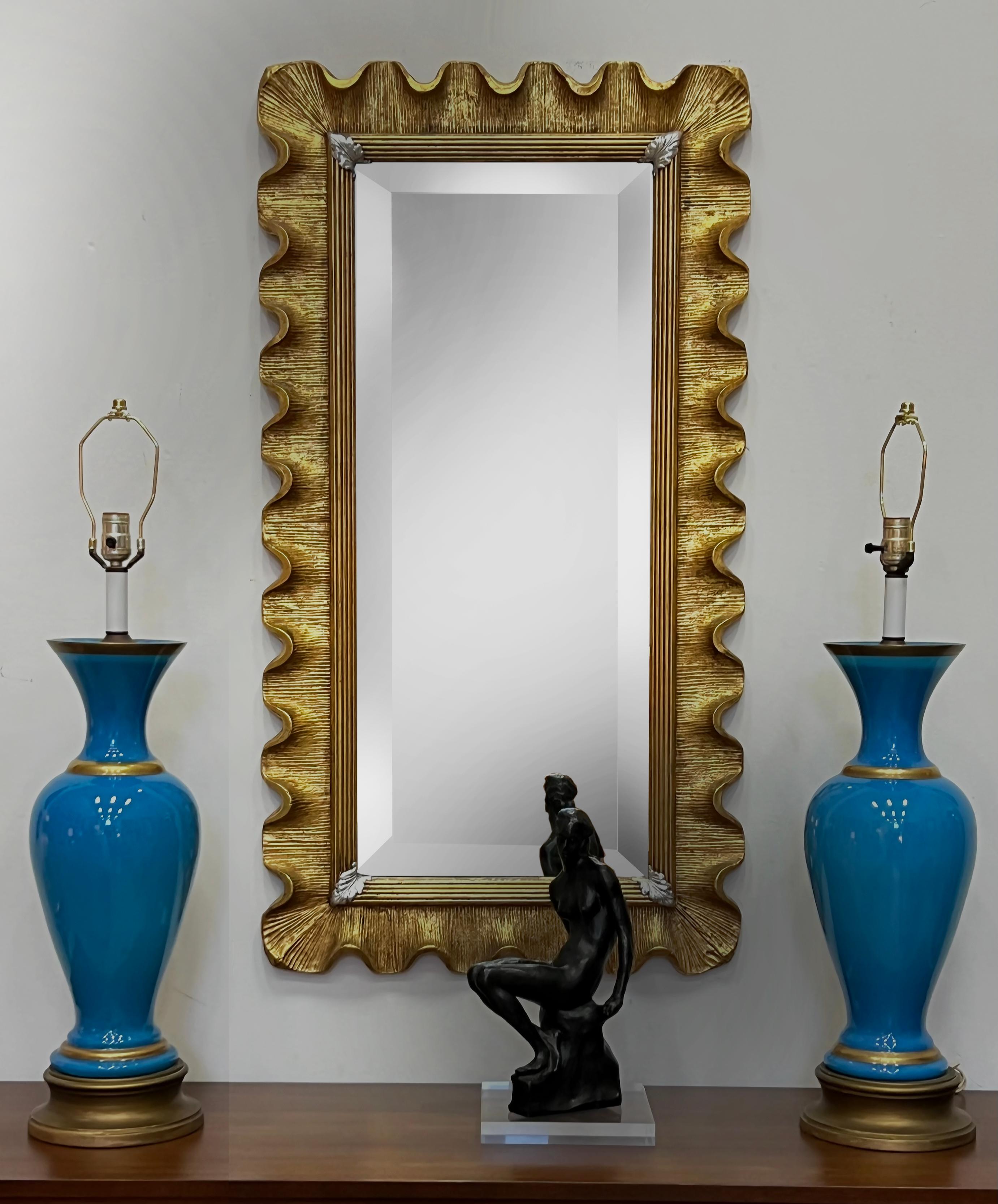 Vintage Carved Scalloped Edge Italian Giltwood Beveled Mirror 

Offered for sale is a vintage Italian Hollywood Regency beveled mirror. The gilt-wood frame has a carved scalloped edge. The mirror can be hung horizontally as well as vertically.