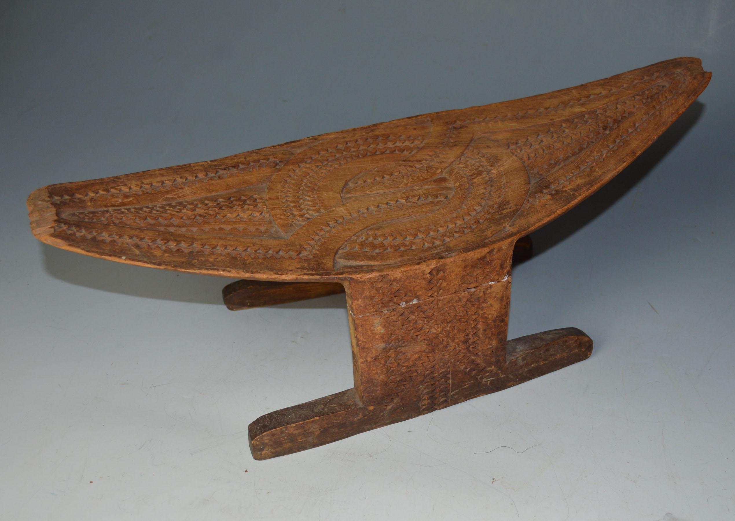 A fine vintage carved Suriname stool with geometric carved decoration, Tribal South Latin American Antiques
 
Suriname South America
Measures: 18 cm height, 51 cm length
Condition: old repairs to legs
Ex missionary collection
Period early 20th