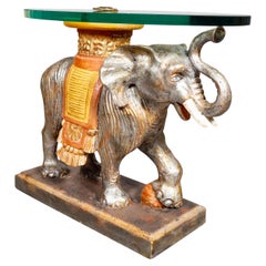 Mesa vintage de madera tallada y pintada con forma de elefante