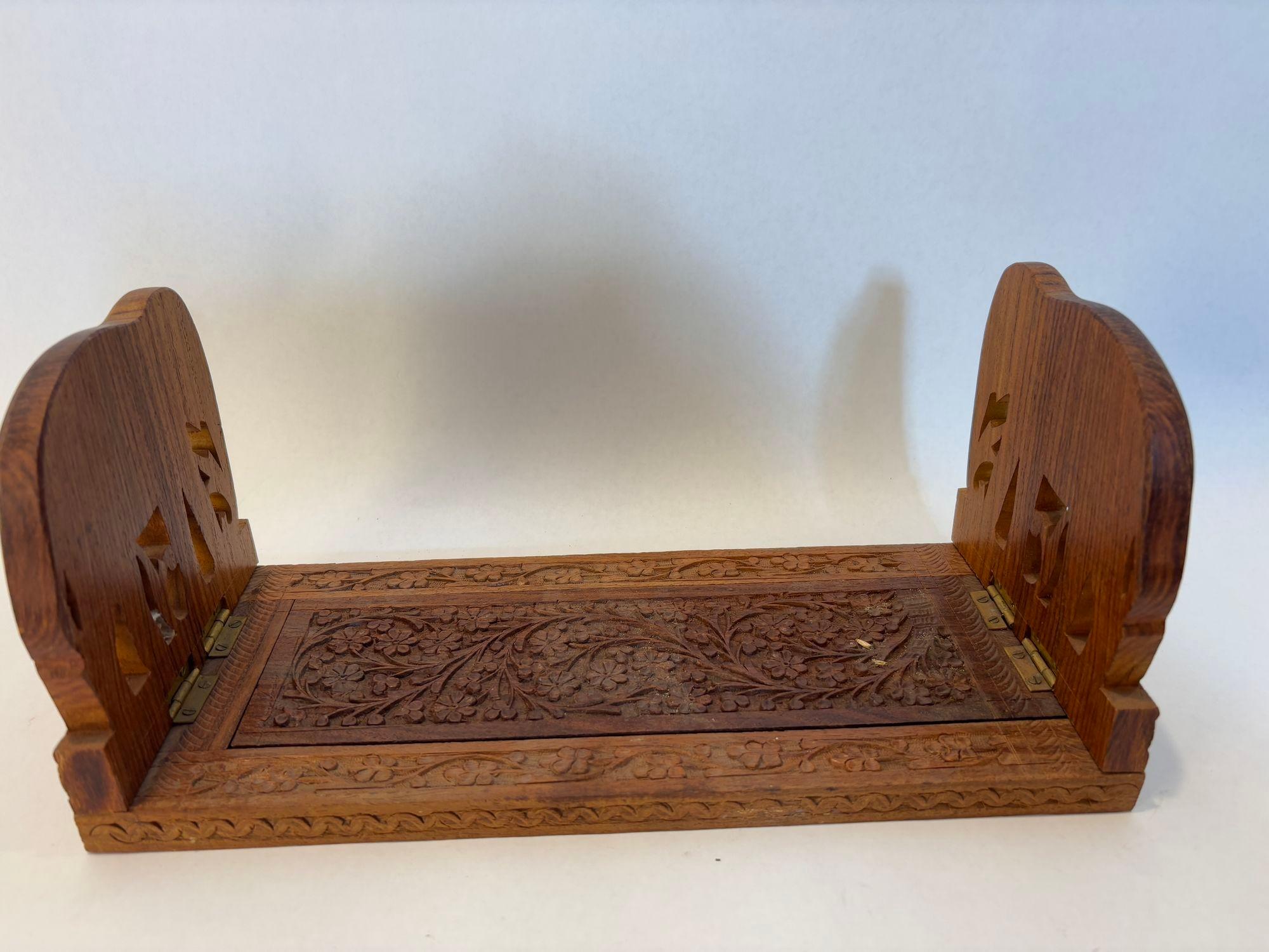Vintage carved wood elephants expanding bookends.
Beautiful carved wood book holder that expands to hold more books.
Beautiful vintage hand carved Indian expandable elephant bookends collapsible bookshelf.
Lovely Anglo Indian style carved wood