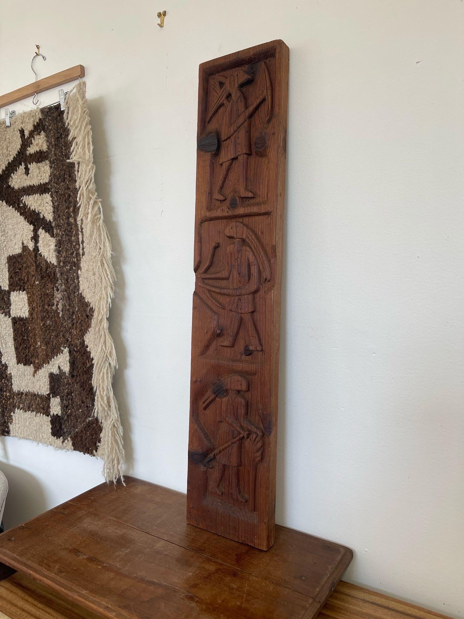 This Piece features primitive designed Carved motifs of people recessed into the wood. Walnut wood tone. Vintage Condition Consistent with Age as Pictured.

Dimensions. 7 1/2 W ; 1 1/2 D ; 37 H