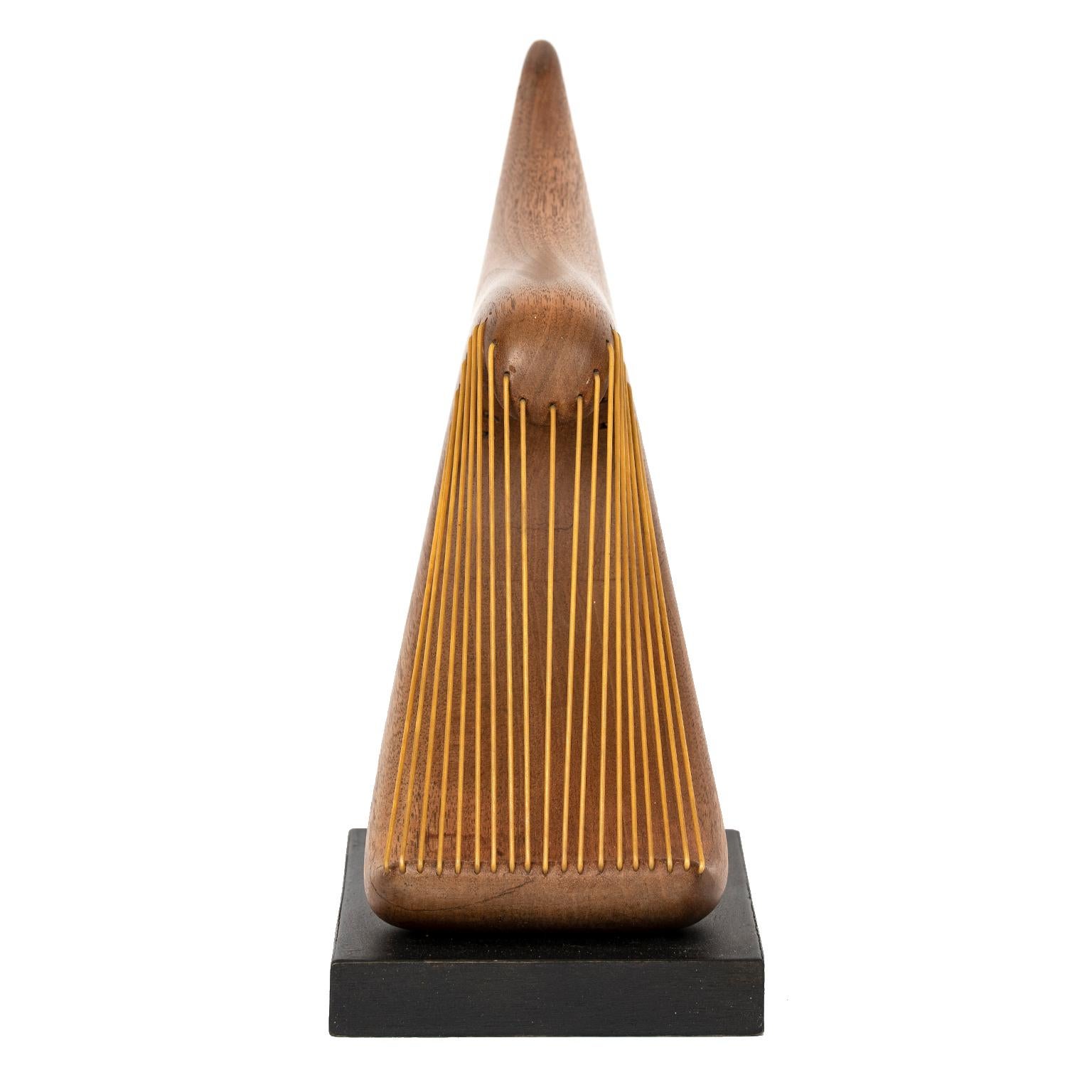 I don't often come across a sculpture that captures my imagination and piques my interest like this unique carved, polished wood and 