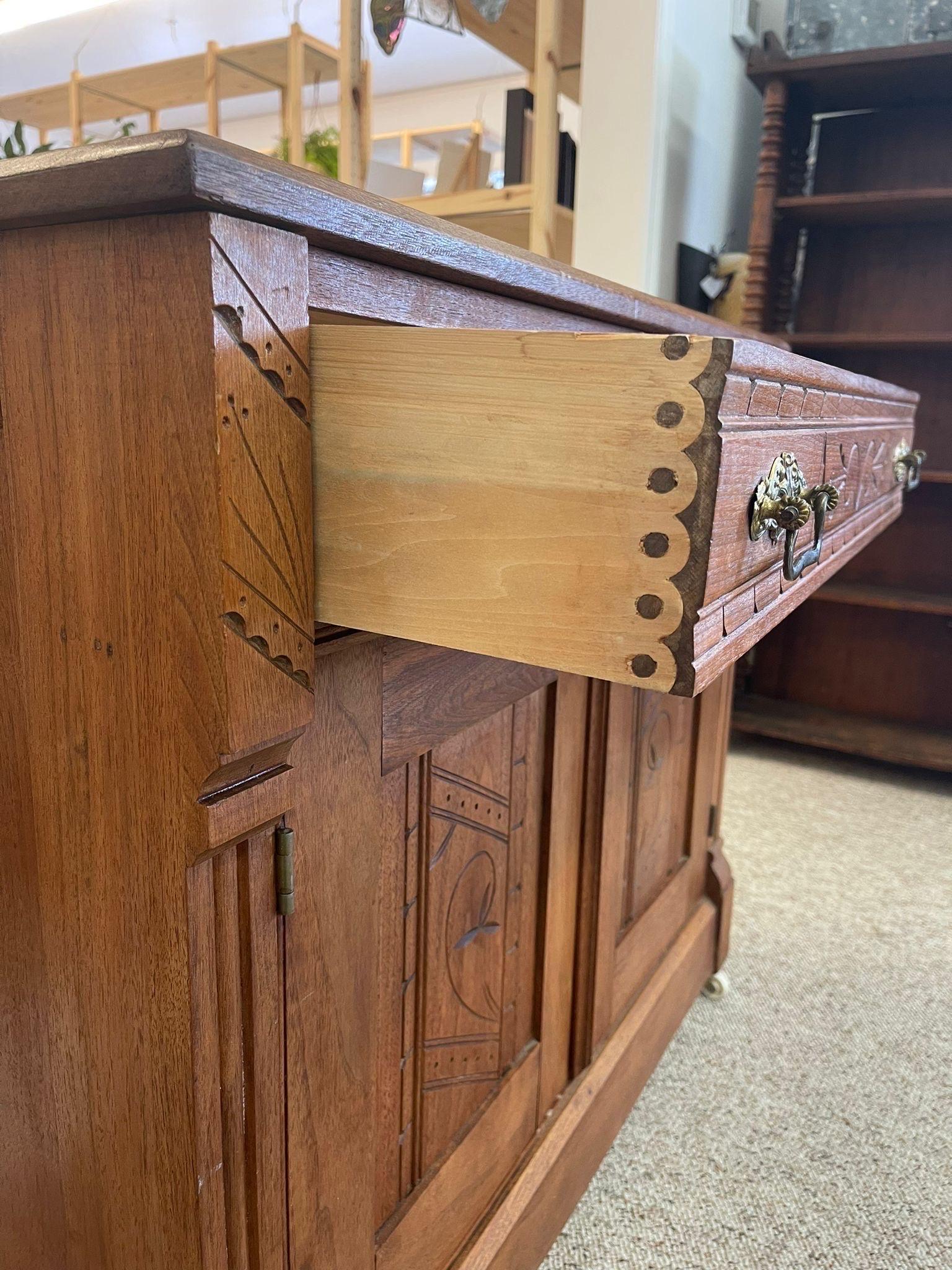 Vintage Carved Wood Victorian Eastlake Style Cabinet on Casters. In Good Condition For Sale In Seattle, WA