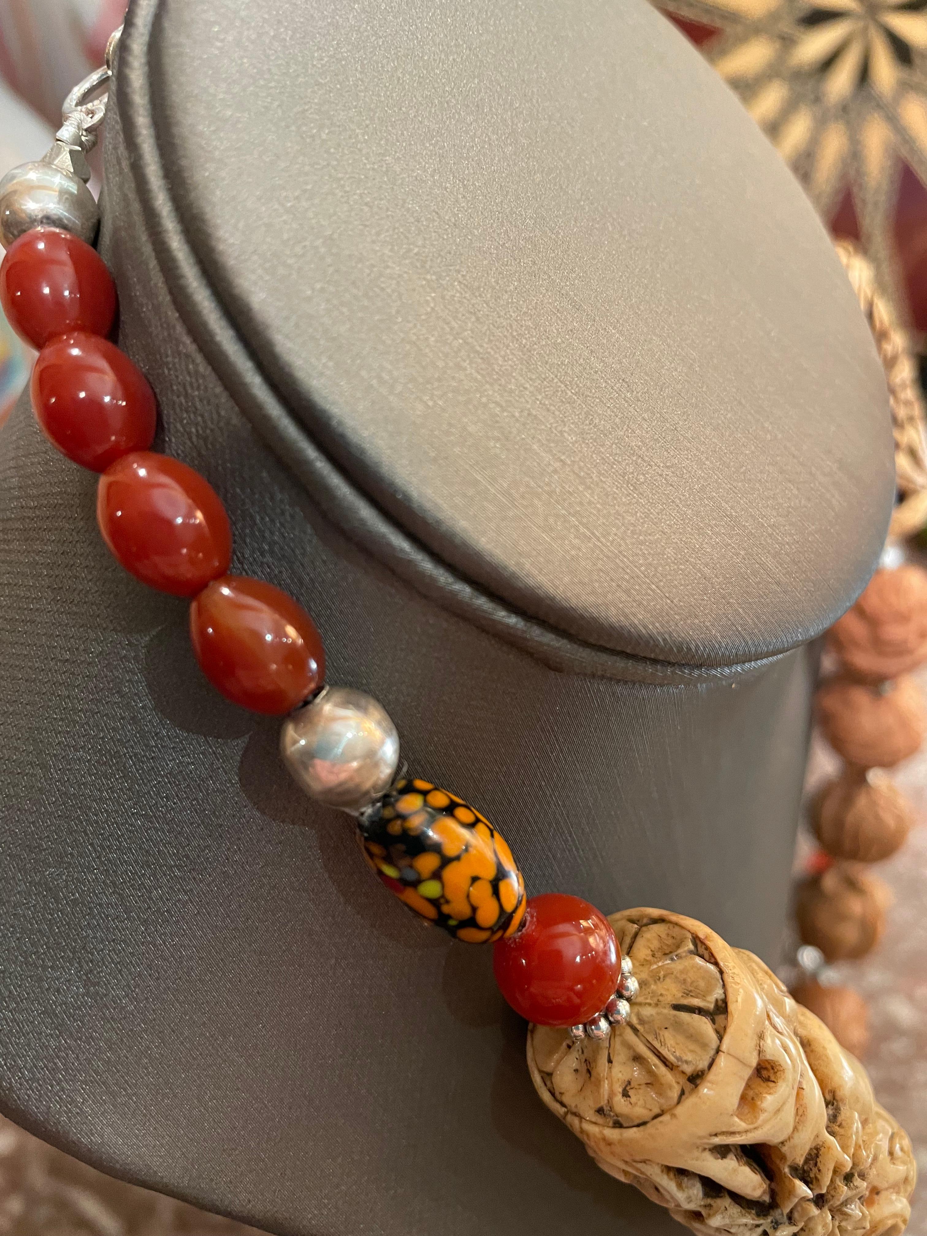 One of a kind, handmade,outstanding necklace is on offer from Lorraine’s Bijoux.It is comprised of hand carved wooden,animal,Chinese beads,vintage Bakelite ,hand carved soapstone barrel beads,Tibetan wooden,inlaid beads,carnelian and Murano glass