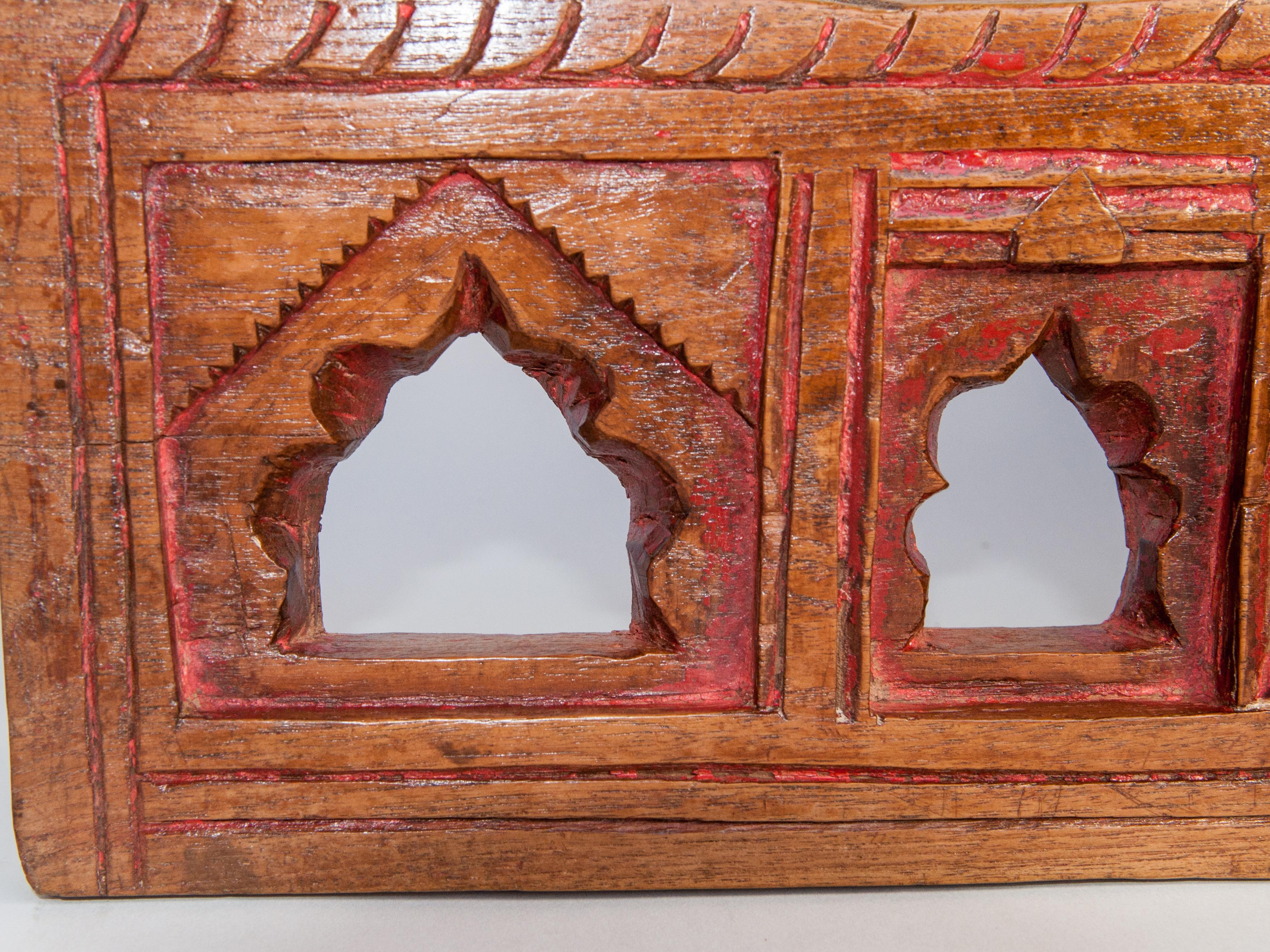 Vintage miniature architectural votive or picture frame, hand carved of wood, with slight traces of original color, mid-20th century, India. Measures: 9.5 wide x 7.5 high
This vintage hand carved wooden frame, from South India, is basically an