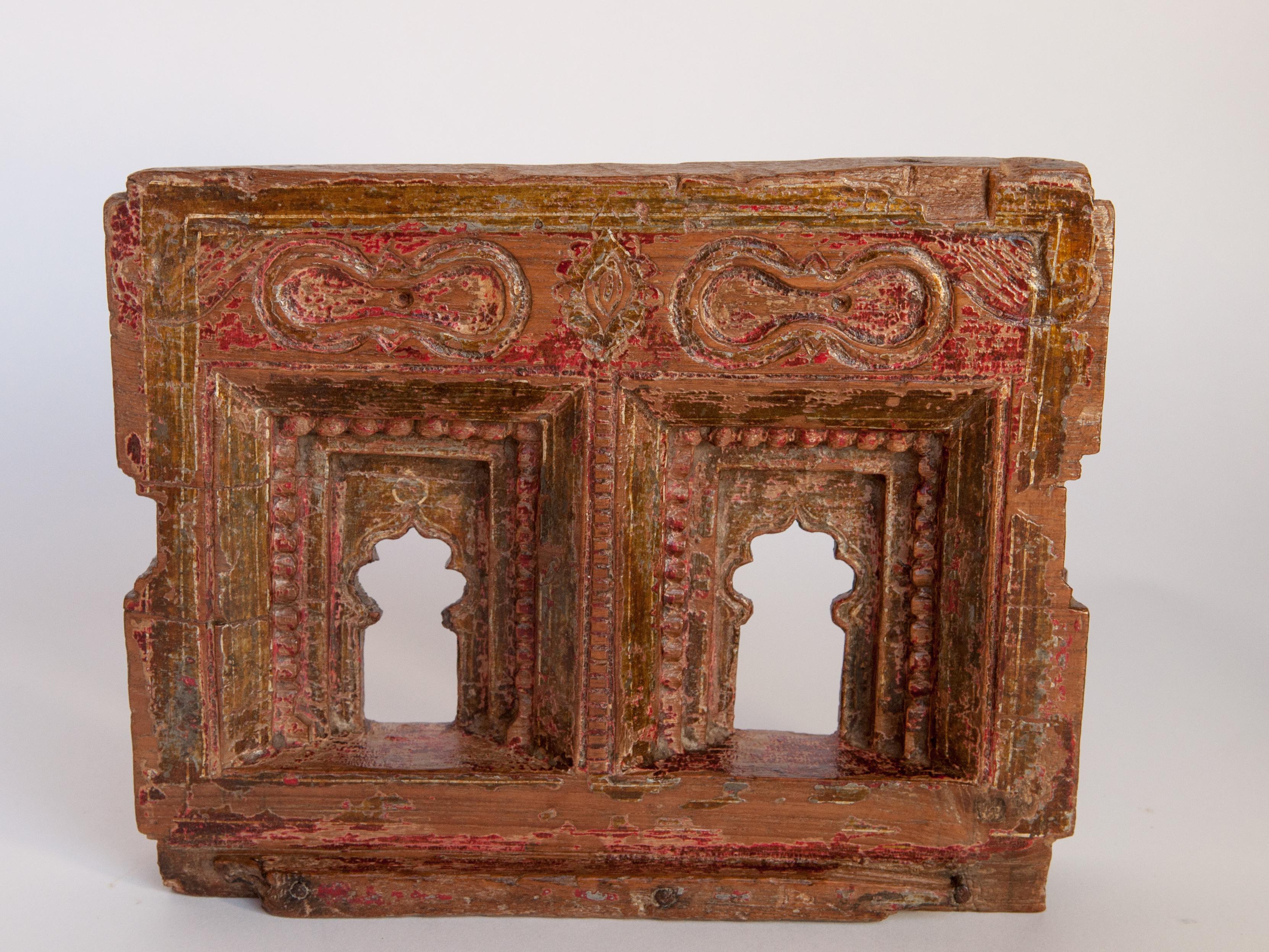Vintage architectural votive miniature or picture frame, hand carved of wood, with traces of original color, mid-20th century, India. Measures: 9.5 wide x 7.5 high.
This vintage hand carved wooden frame, from South India, is basically a miniature