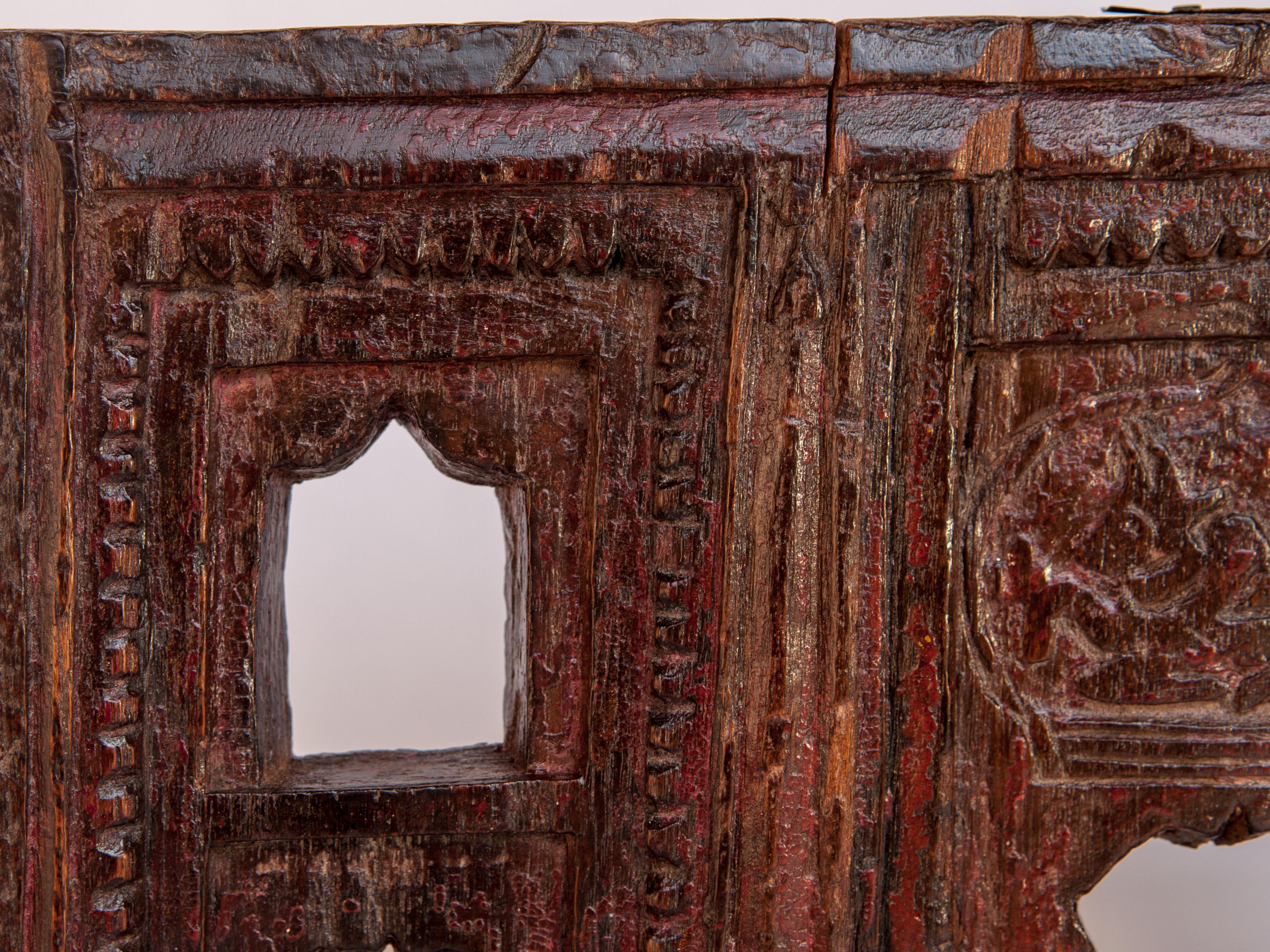 Vintage miniature architectural votive or picture frame, mid-20th century, India. Wooden, Hand carved. Measures: 18 wide x 12.25 high.
This vintage hand carved wooden frame, from India, is basically a rustic architectural rendering of a house