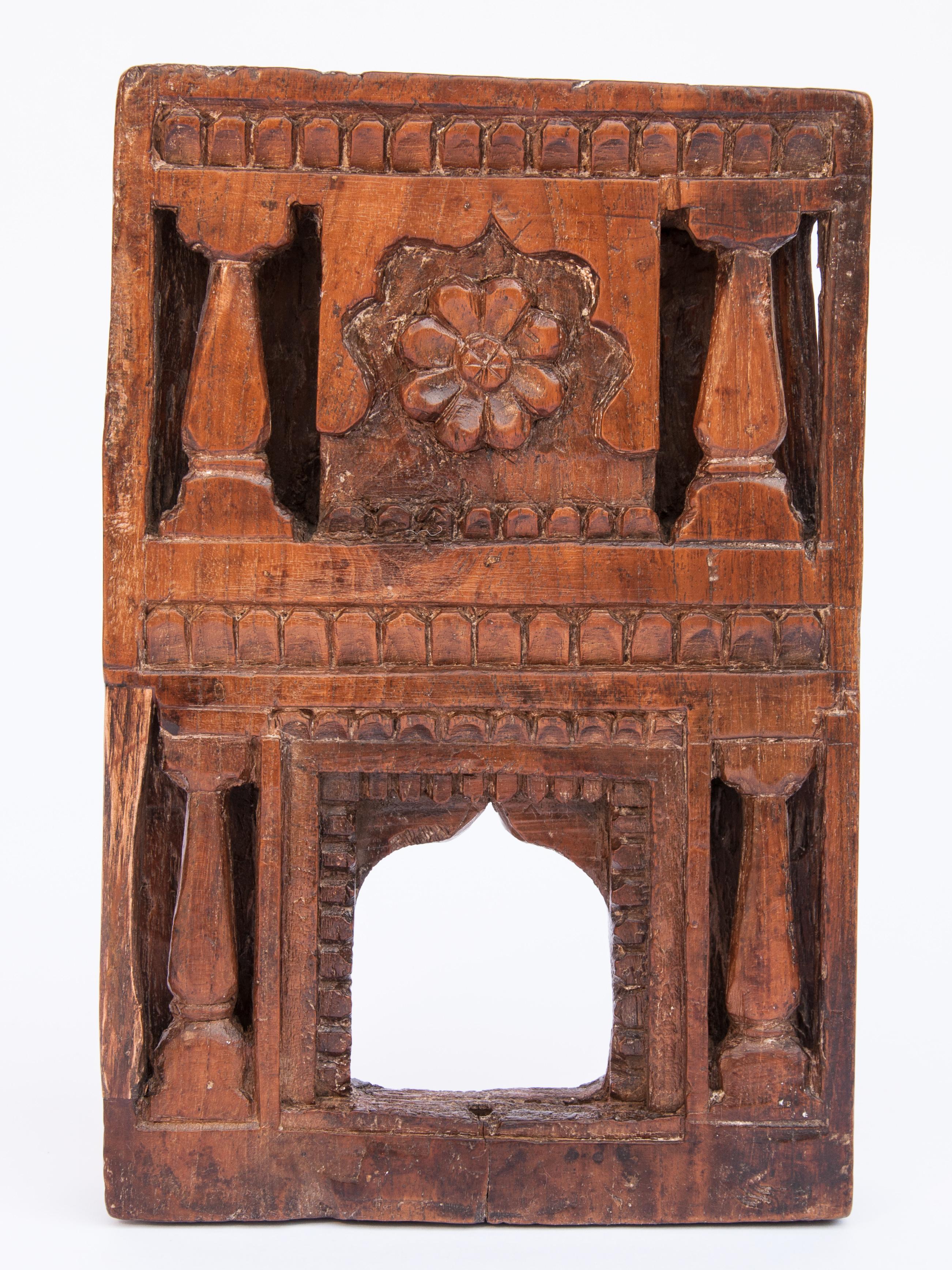 Vintage miniature architectural votive or picture frame. Mid-20th century, India. Wooden, hand carved, mid-20th century. Measures approx: 6 inches wide x 9 inches high. 
This vintage hand carved wooden frame, from South India, is basically a rustic