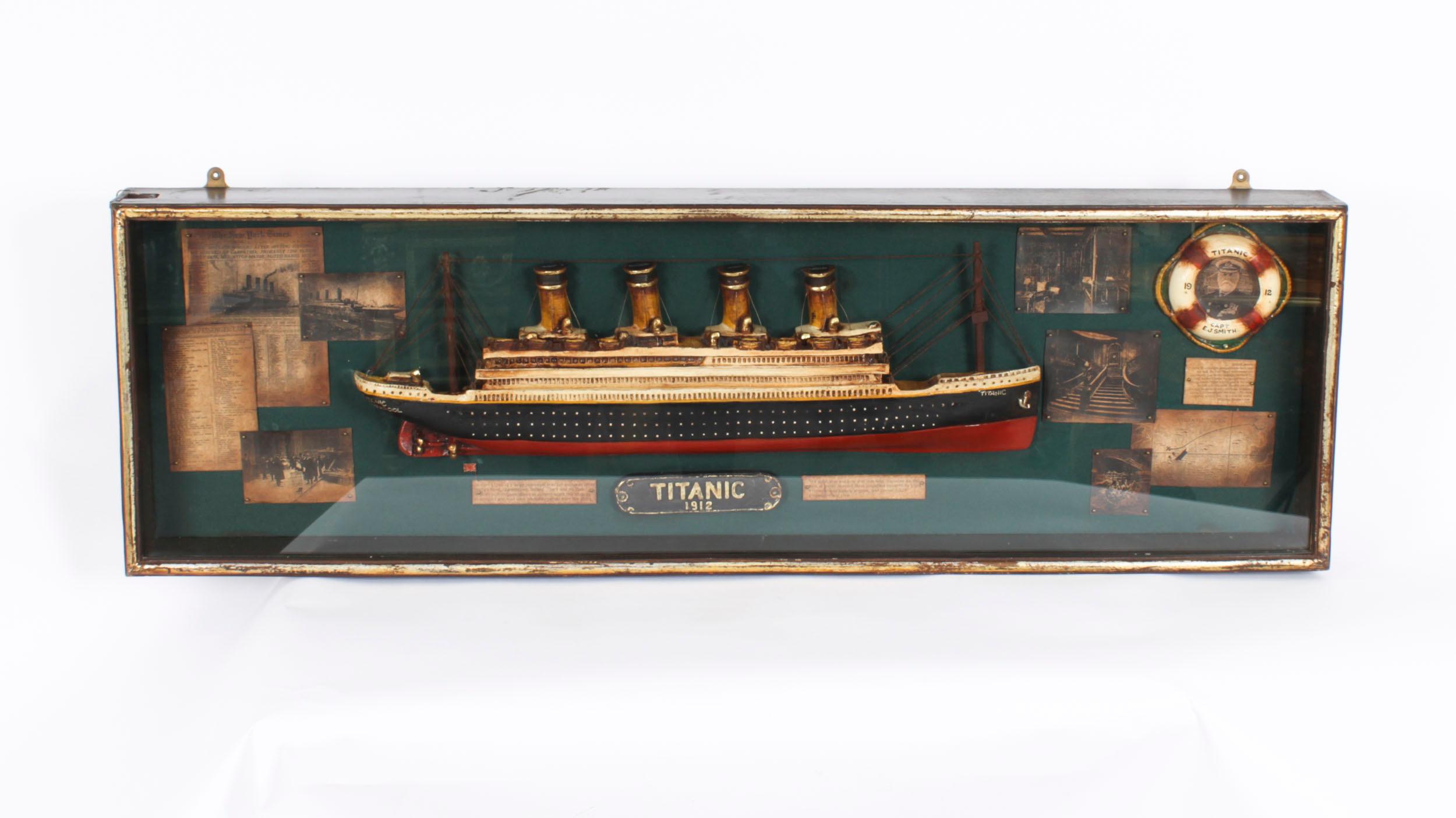 A vintage diorama of the Titanic, mid 20th Century in date.

The cased diorama displays a cross-section of the ship with newspaper cuttings and associated narratives and photographs.

Condition:
In good condition, please see photos for