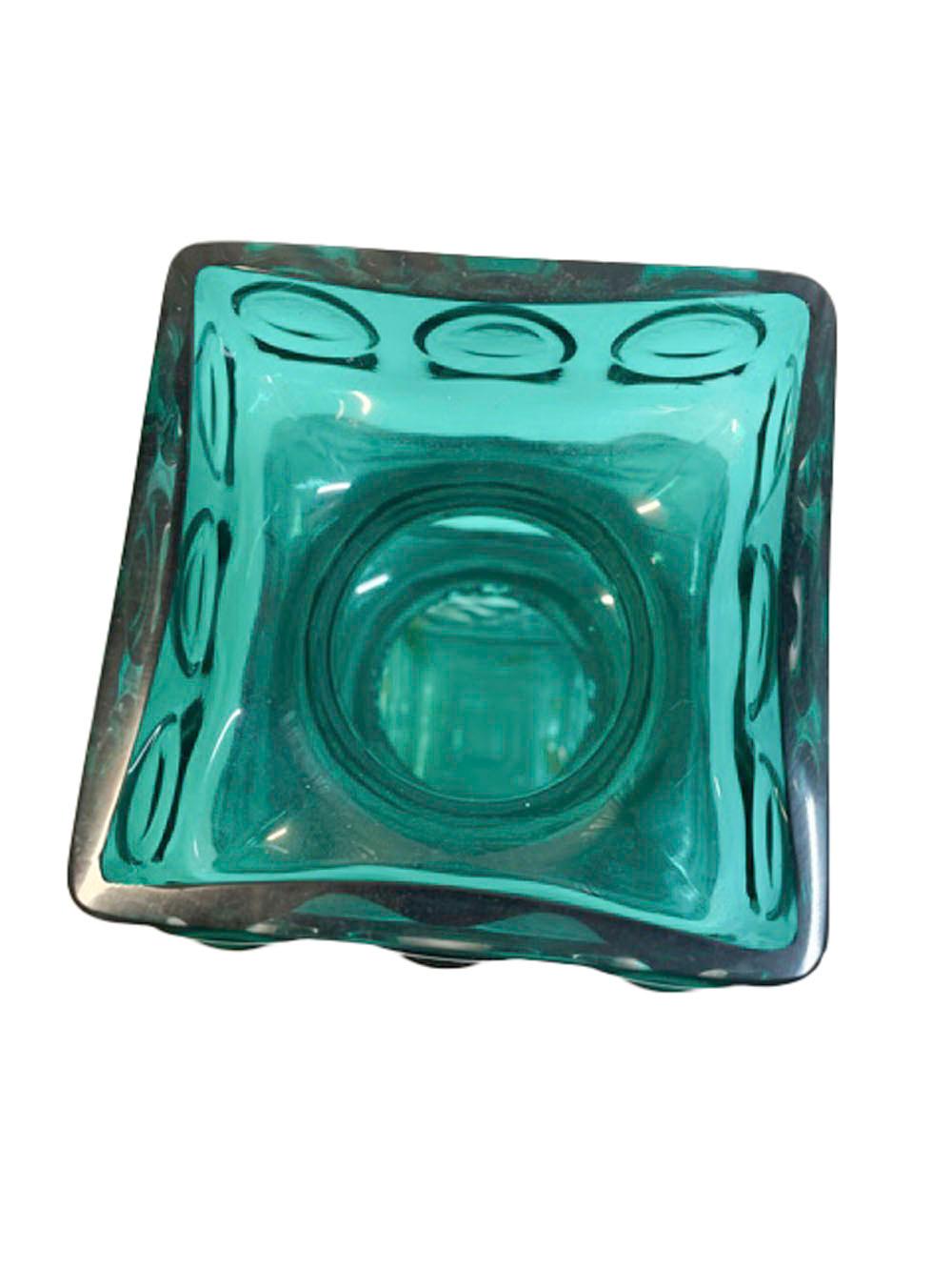 Mid-Century Modern Riihimaki green and clear cased glass vase of square form with textured surface, the top molded with 2 waisted bands separating a squared collar and rim each molded with 3 raised rings to each side.