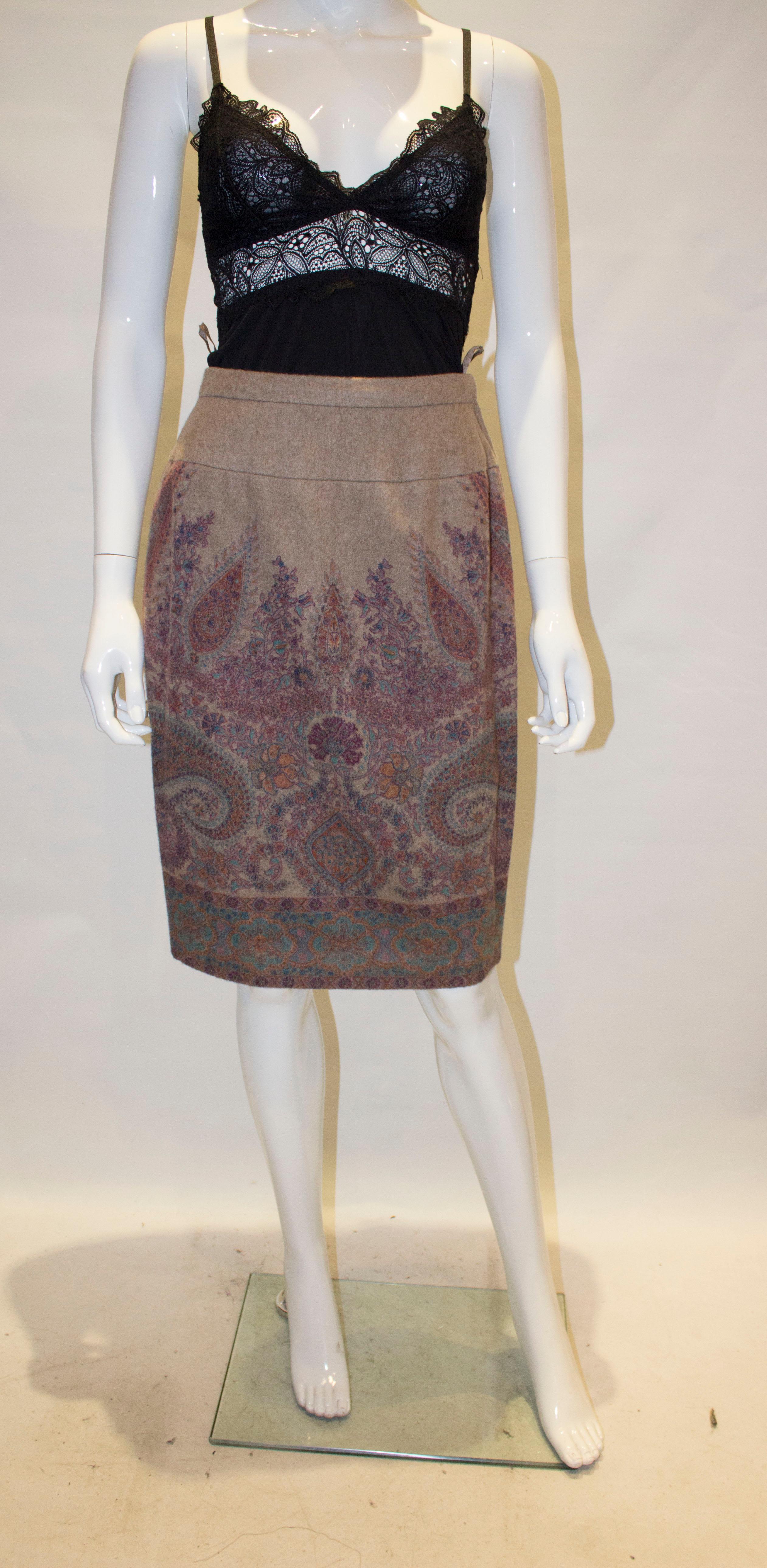 A lovely vintage skirt in biscuit colour cashmere with a pretty paisley design. 
The skirt is fully lined