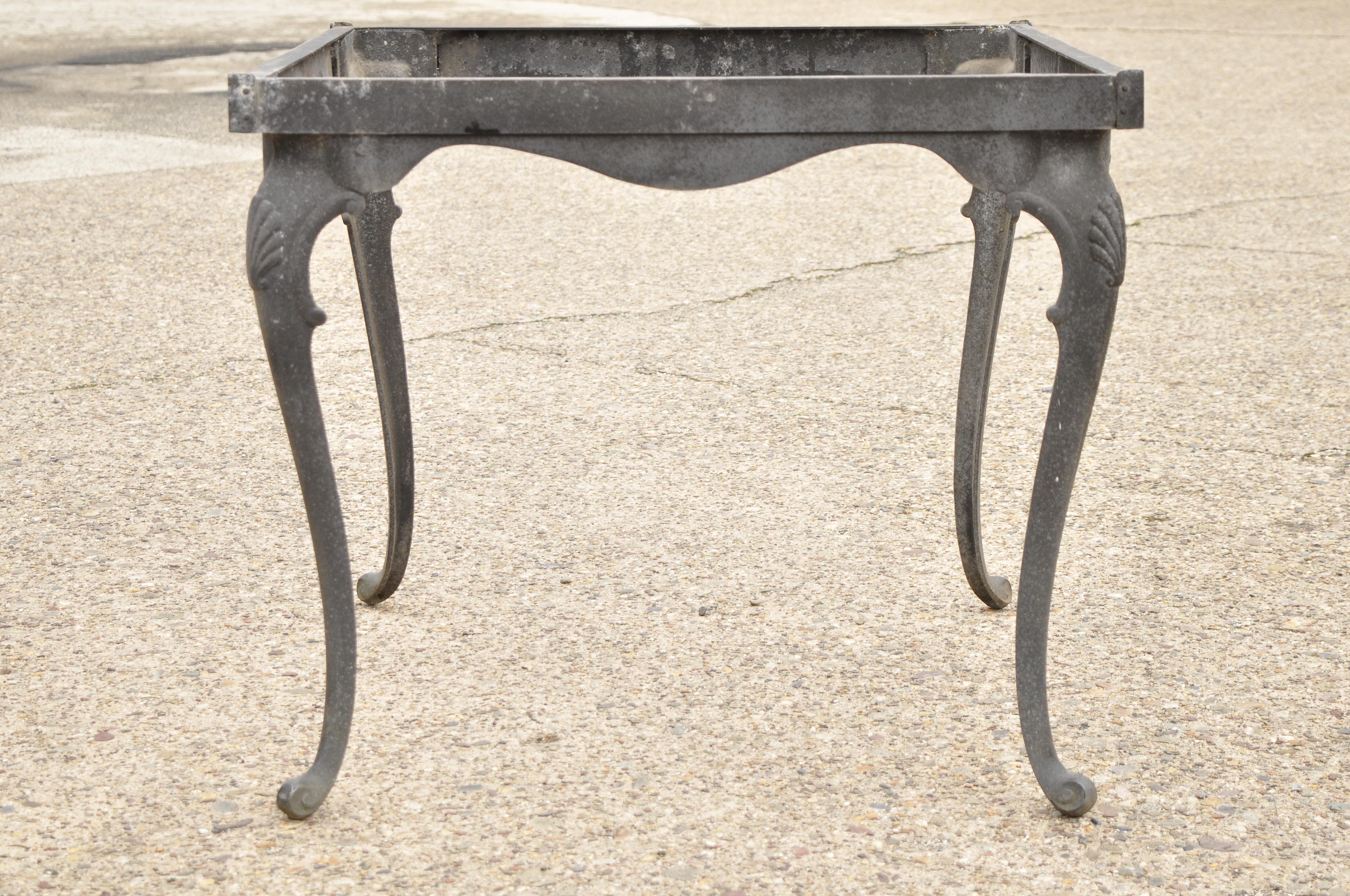 Vintage cast aluminum cabriole leg shell square patio dining table attributed to Molla. Item includes shell accents to knees, cats aluminum construction, cabriole legs, very nice vintage item, circa mid-late 20th century. Measurements: 28.5