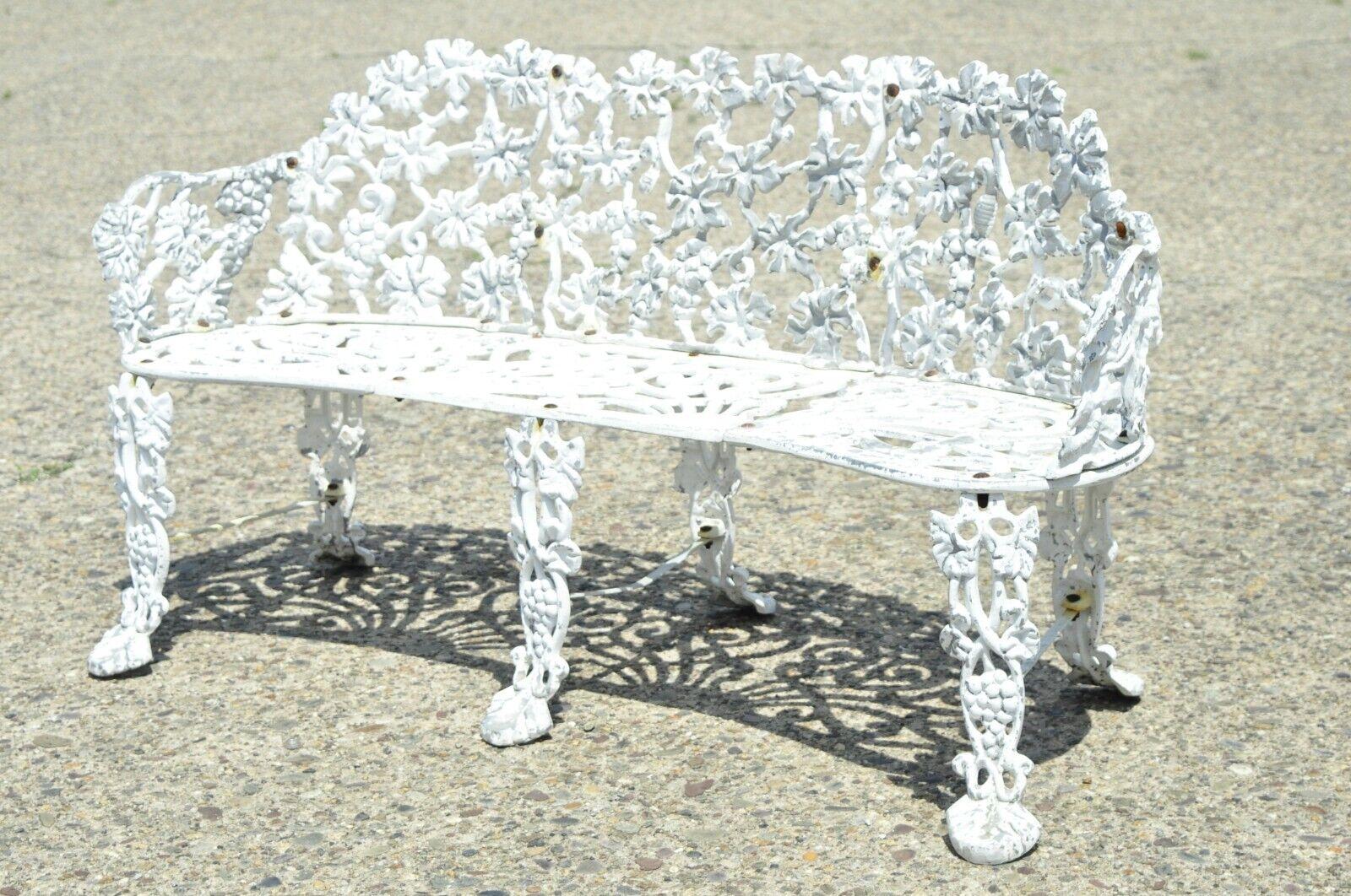 Vintage cast aluminum grape and leaf vine outdoor garden loveseat bench settee. Item features cast aluminum construction, grape vine pattern, pierced scroll work seat, very nice vintage item, great style and form. Circa mid 20th century.