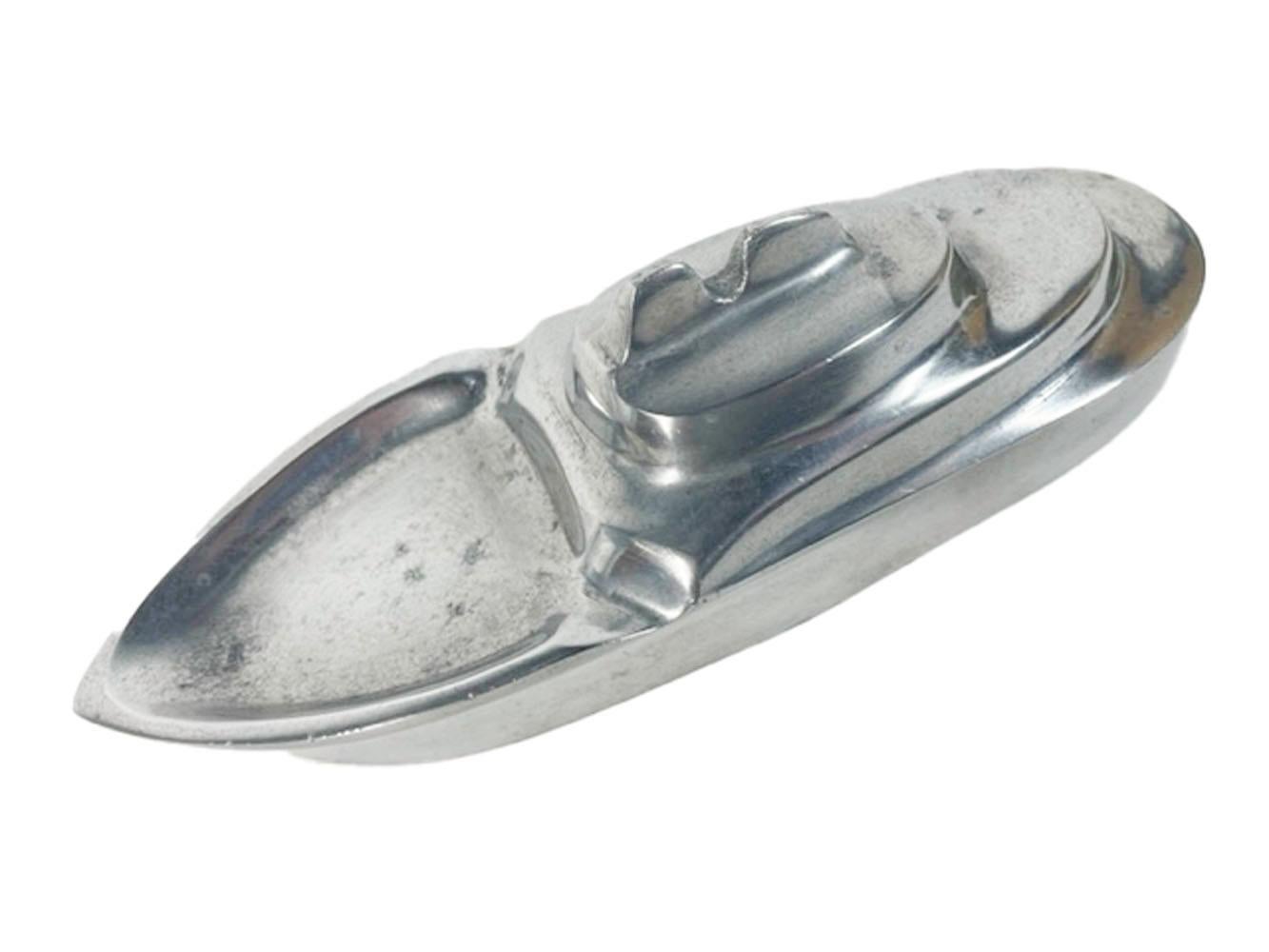Vintage hand finished cast aluminum ashtray for cigars or cigarettes in the form of a streamlined ocean liner.