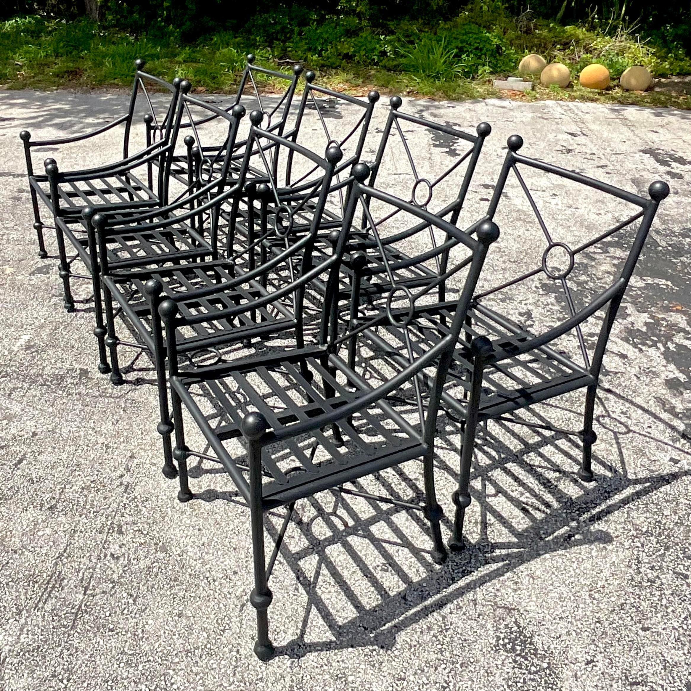 Elevate your dining experience with this set of 8 vintage Boho cast aluminum target back dining chairs. Inspired by American craftsmanship, these chairs blend intricate design with sturdy construction for both style and comfort. Perfect for