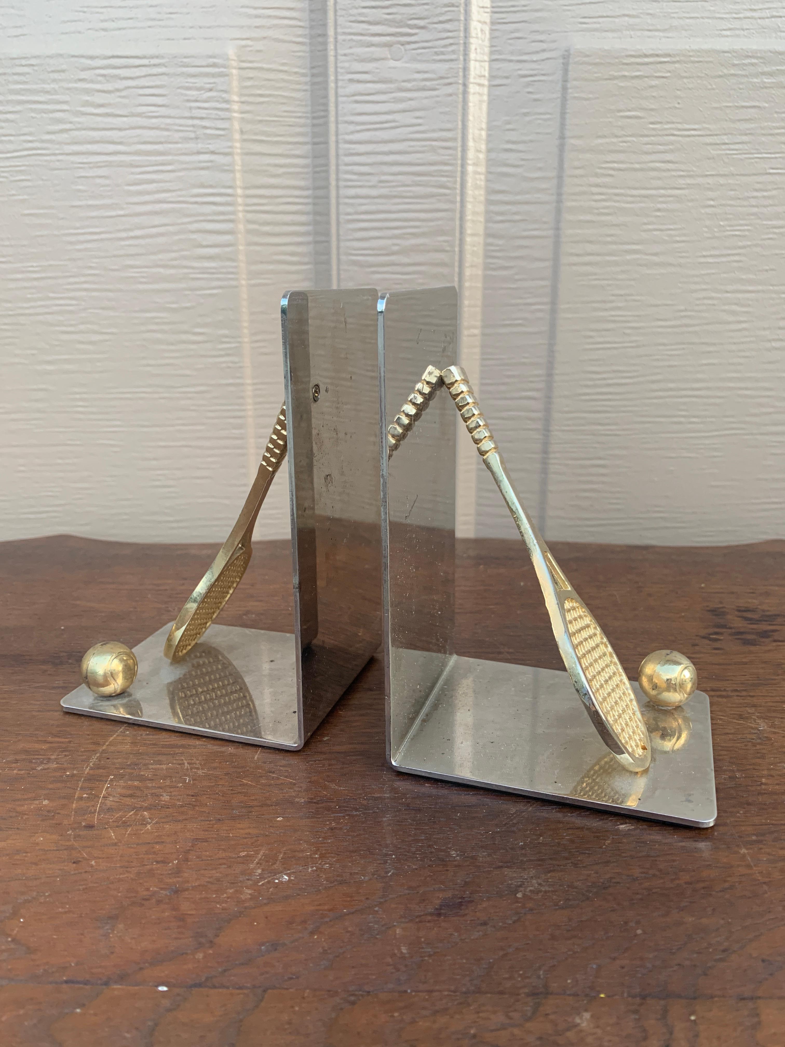A beautiful pair of cast brass bookends in the form of two tennis rackets and tennis balls.

USA, Circa 1980s

Measures: 4