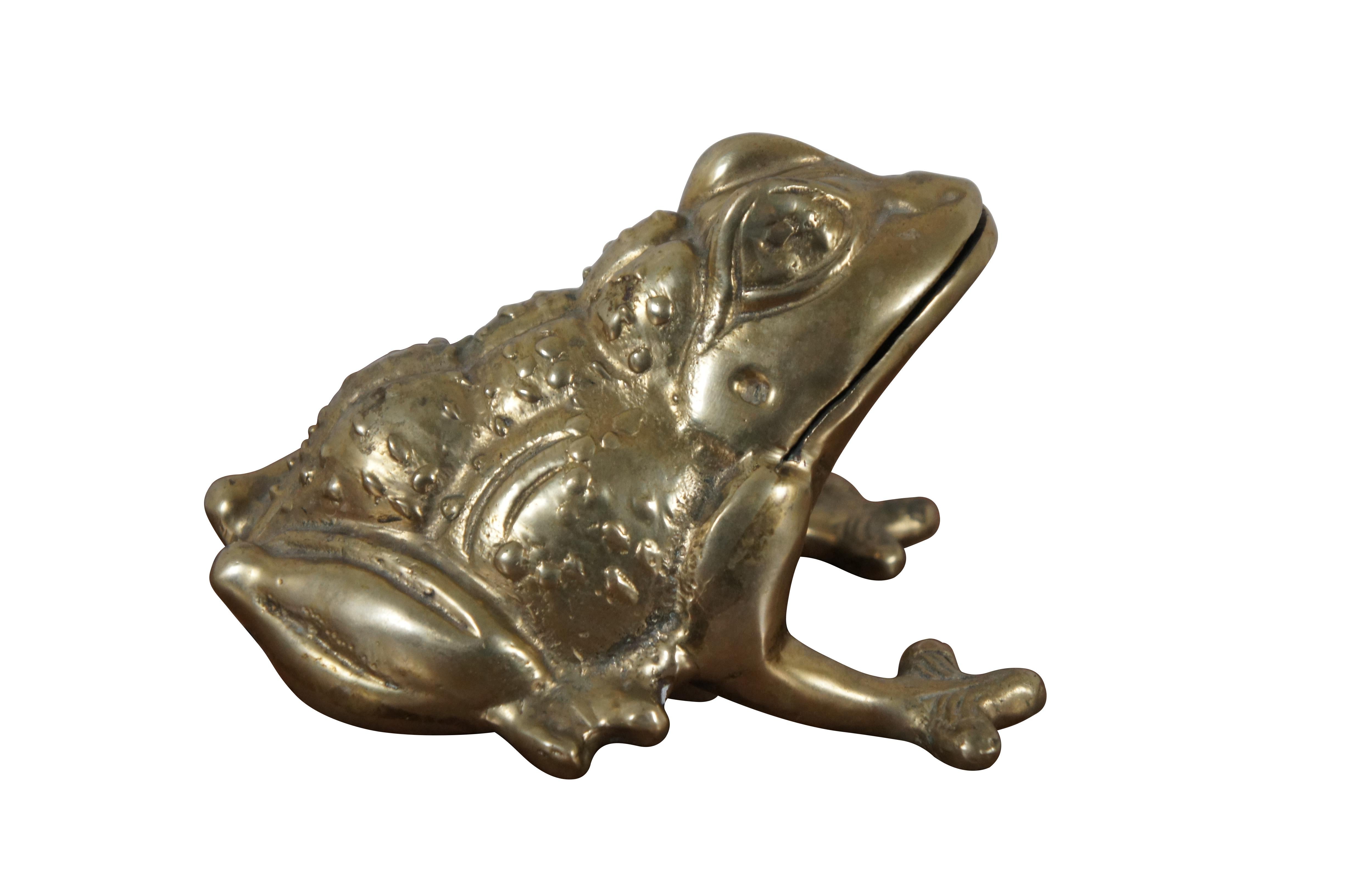 Vintage bright brass desktop figurine / paperweight in the shape of a frog / toad with a wart covered back and a mouth slit that could accommodate a note / letter.

Dimensions:
5.5